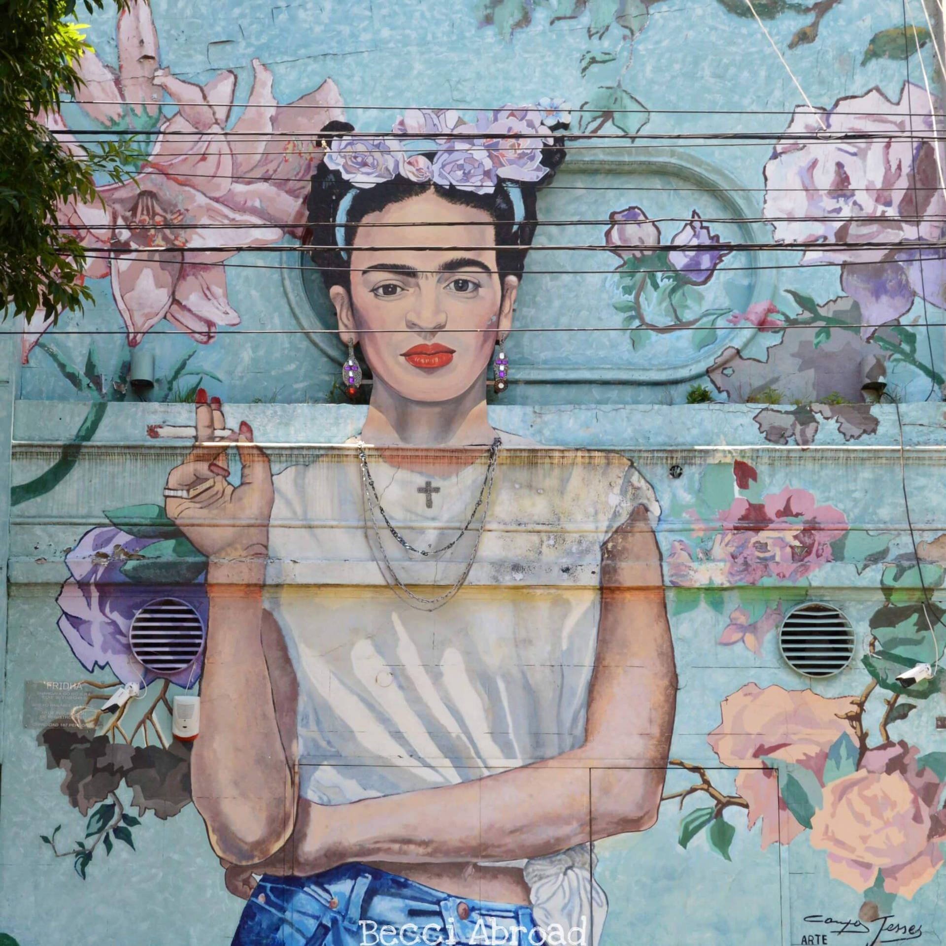 A mural of Frida Kahlo smoking a cigarette - Frida Kahlo