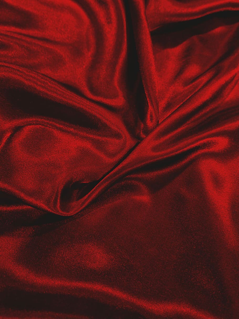 A close up of a red velvet fabric with a subtle sheen. - Silk