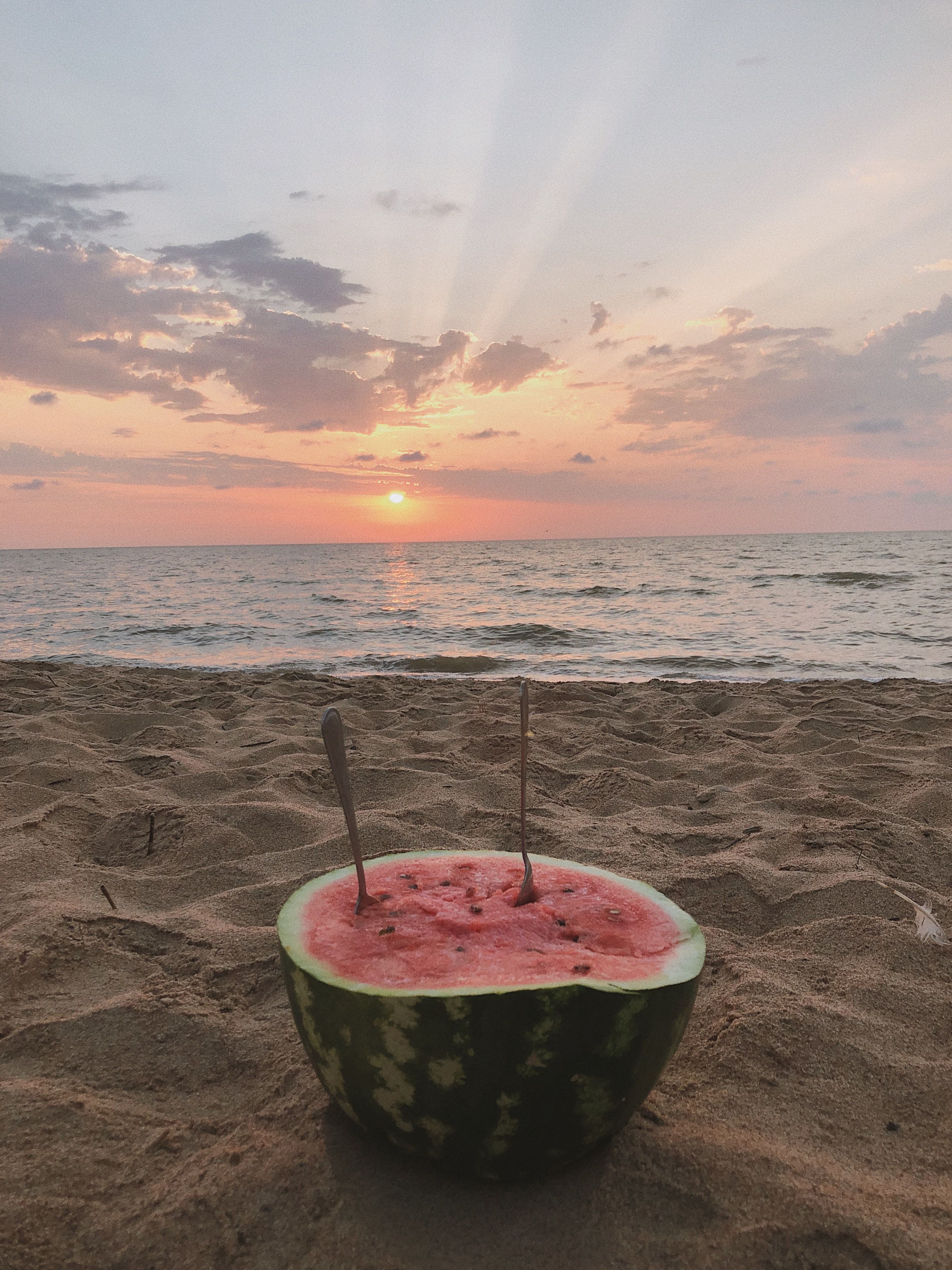 Photo of a Watermelon at the Beach During Sunset · Free