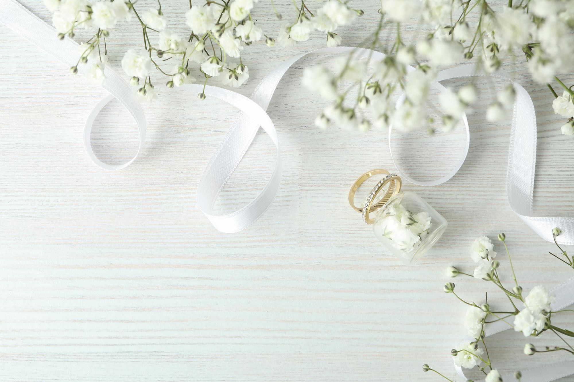 A wedding background image with two rings and flowers - Wedding