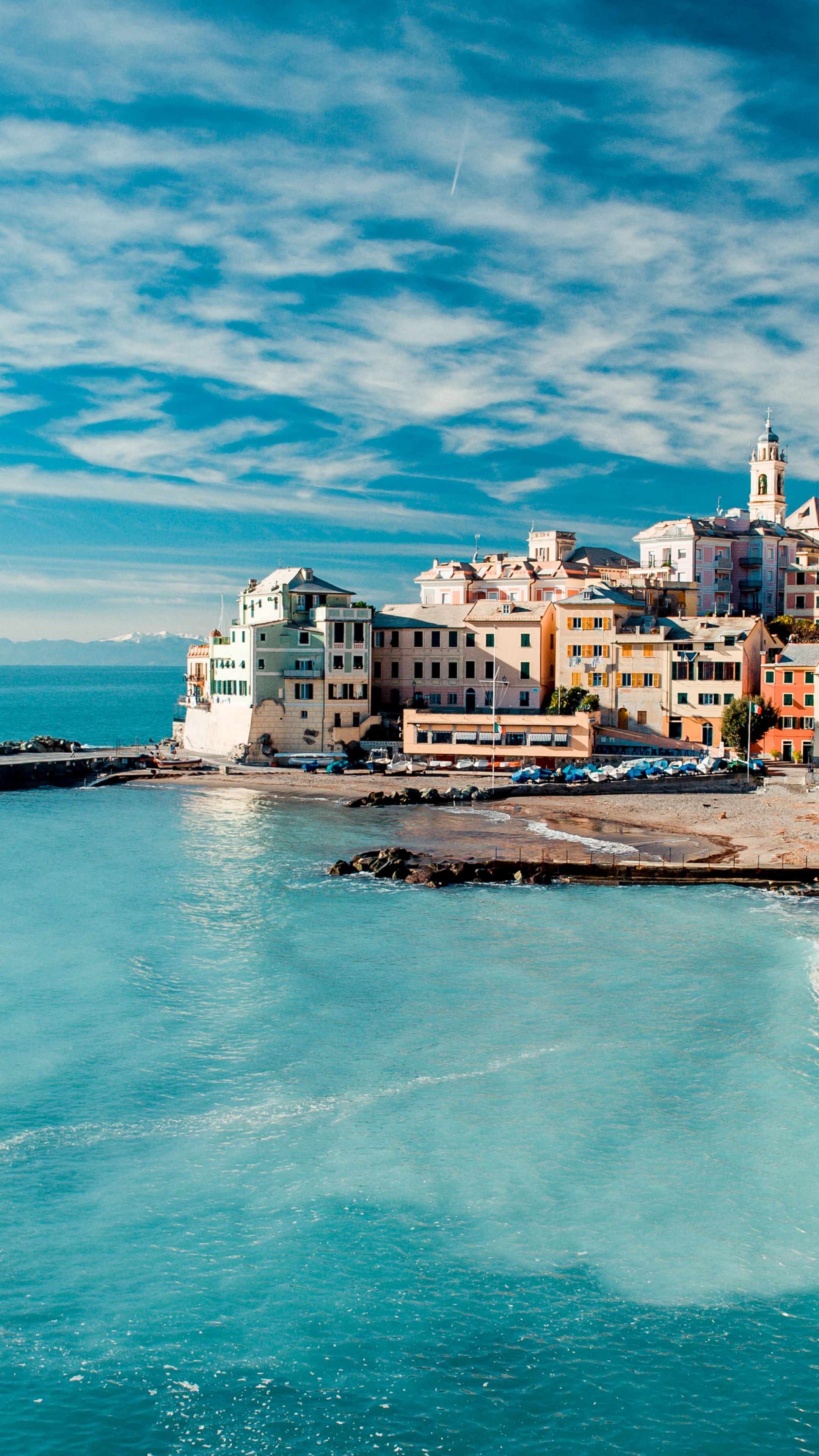 A city on the beach with a blue sky - Italy