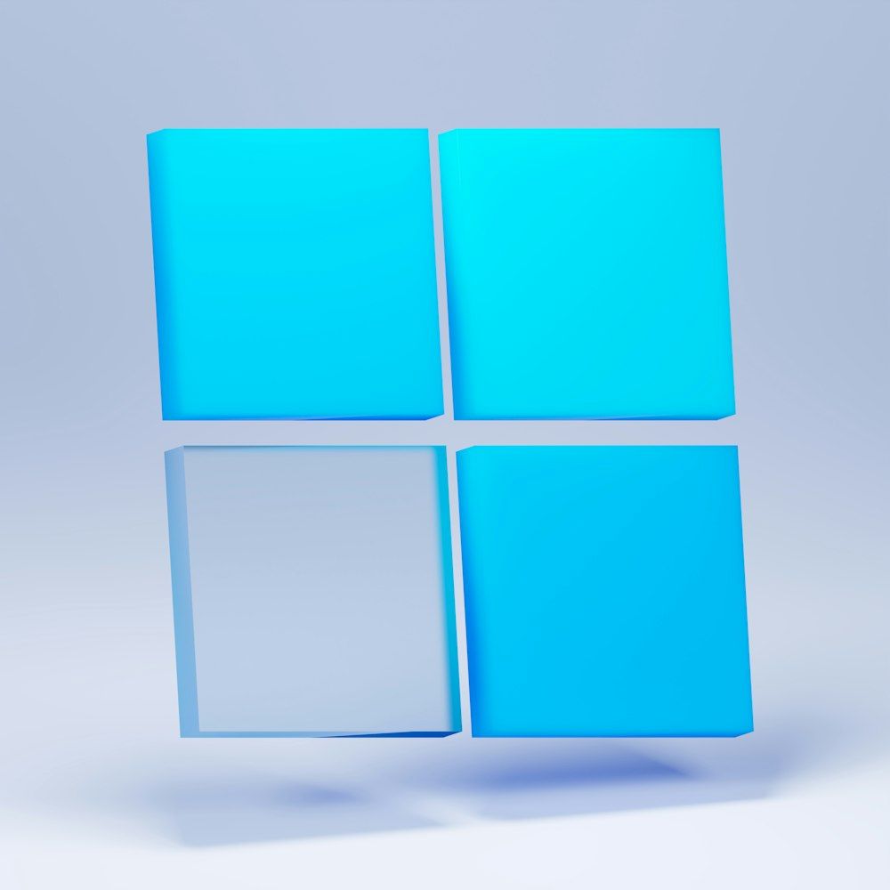 The Windows 11 logo in blue, on a blue background - Windows 10