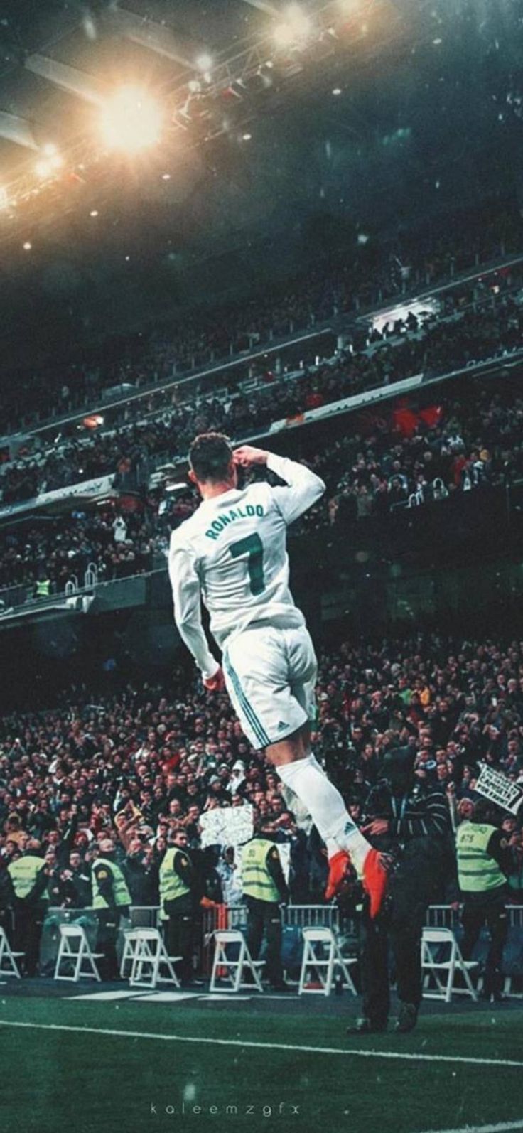 Cristiano Ronaldo jumping in the air in front of a crowd of fans - Cristiano Ronaldo