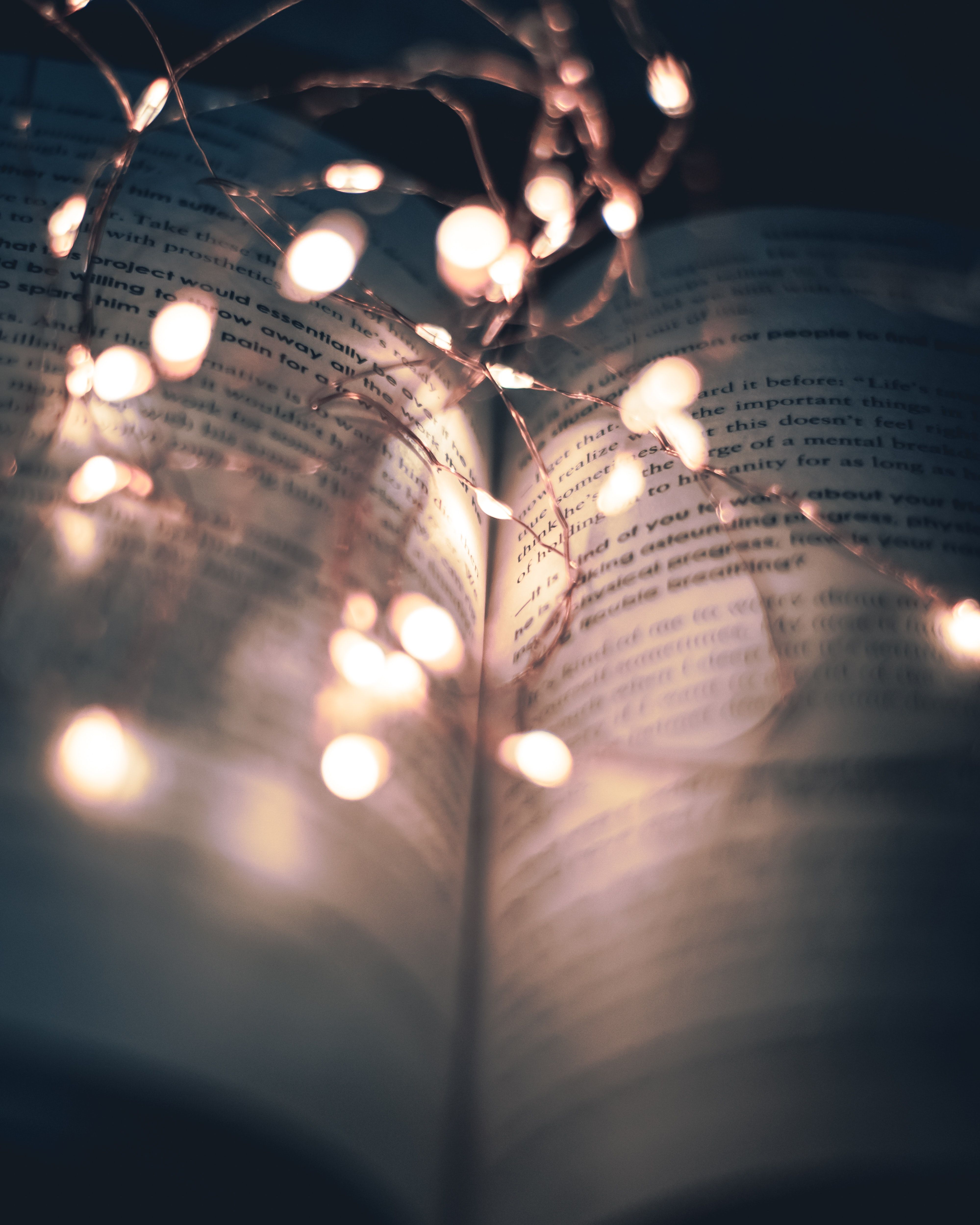A book with fairy lights in the background - Fairy lights