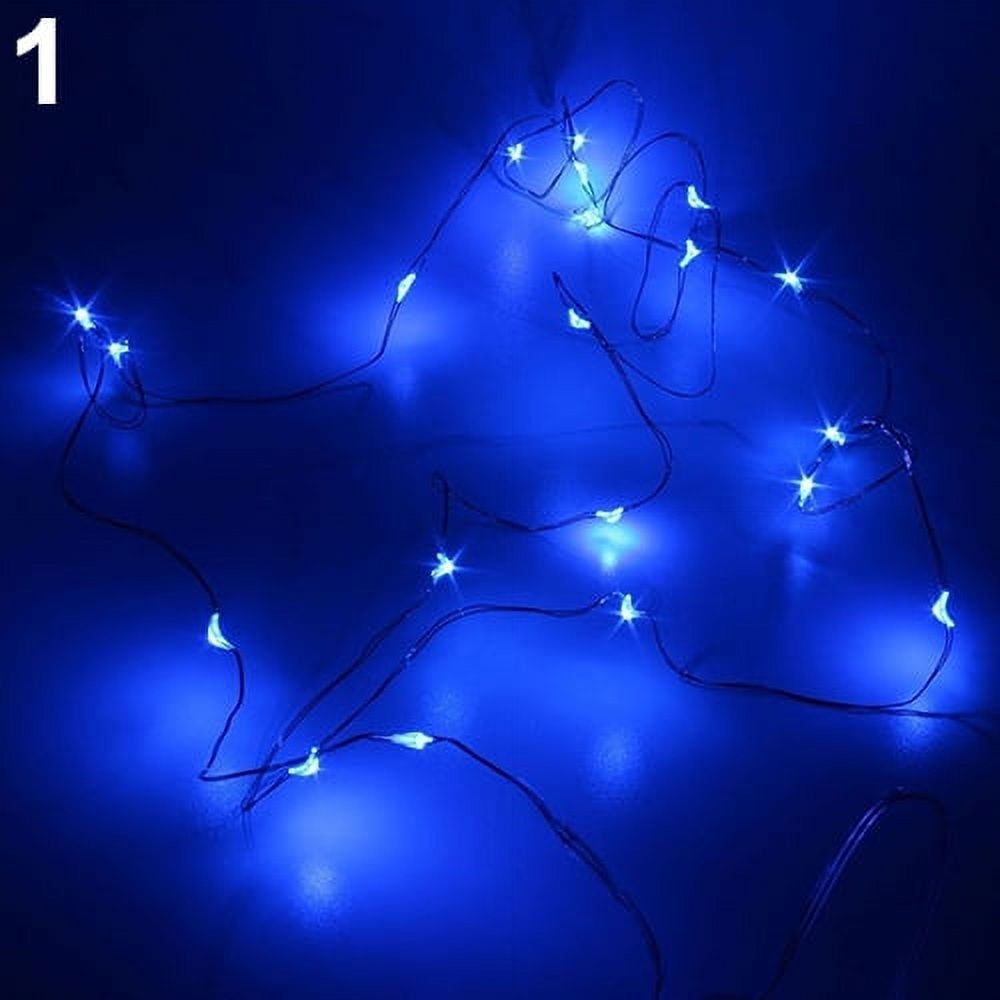 A string of blue lights on a dark background. - Fairy lights