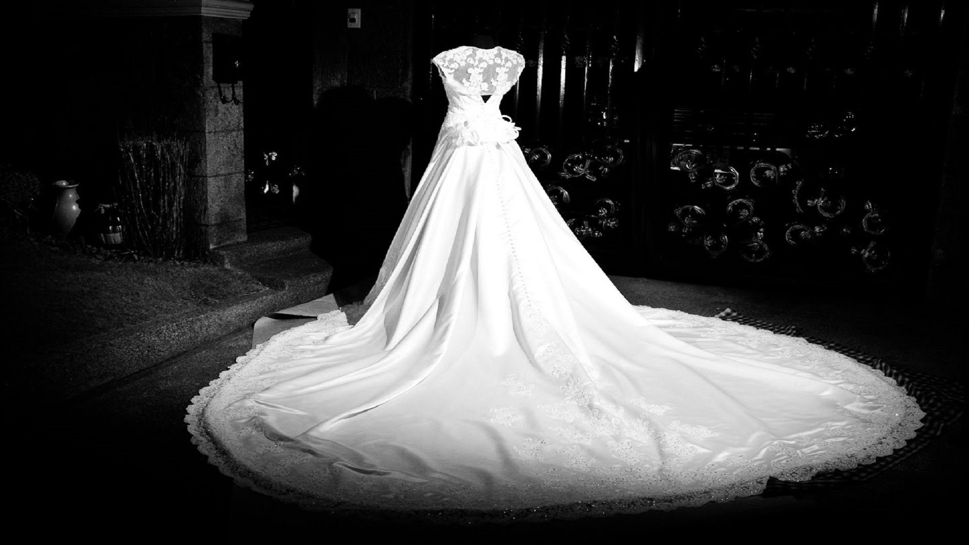 A wedding dress is on display in the dark - Wedding