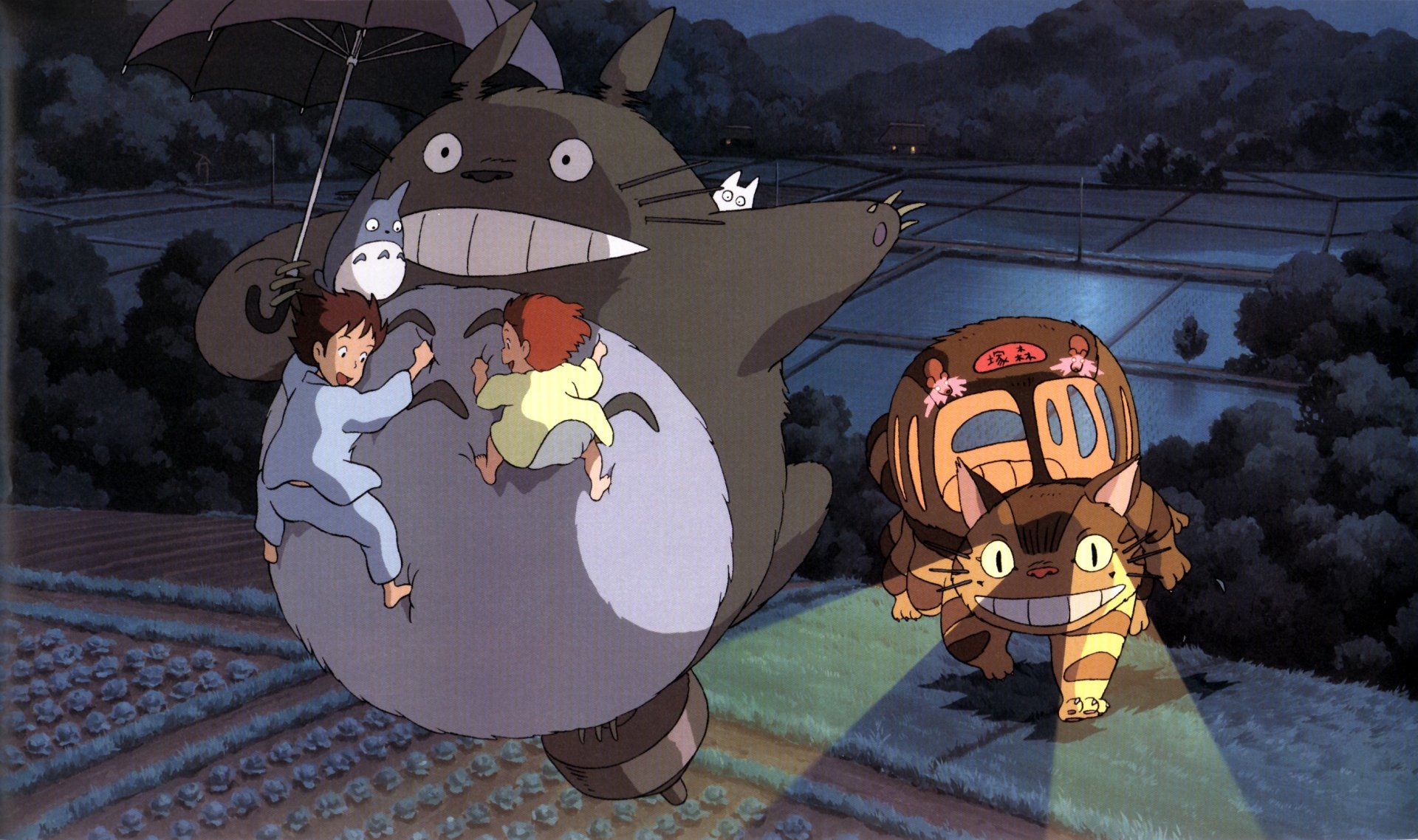 A still from My Neighbor Totoro, featuring two young girls and a boy sitting on the back of a giant cat-like creature. - My Neighbor Totoro