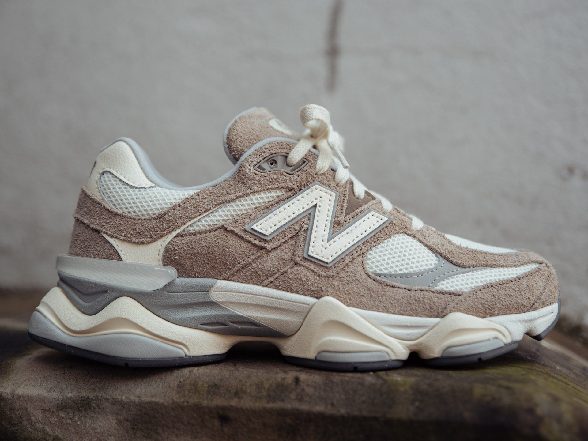 A pair of New Balance 2002R sneakers in a beige colorway. - New Balance