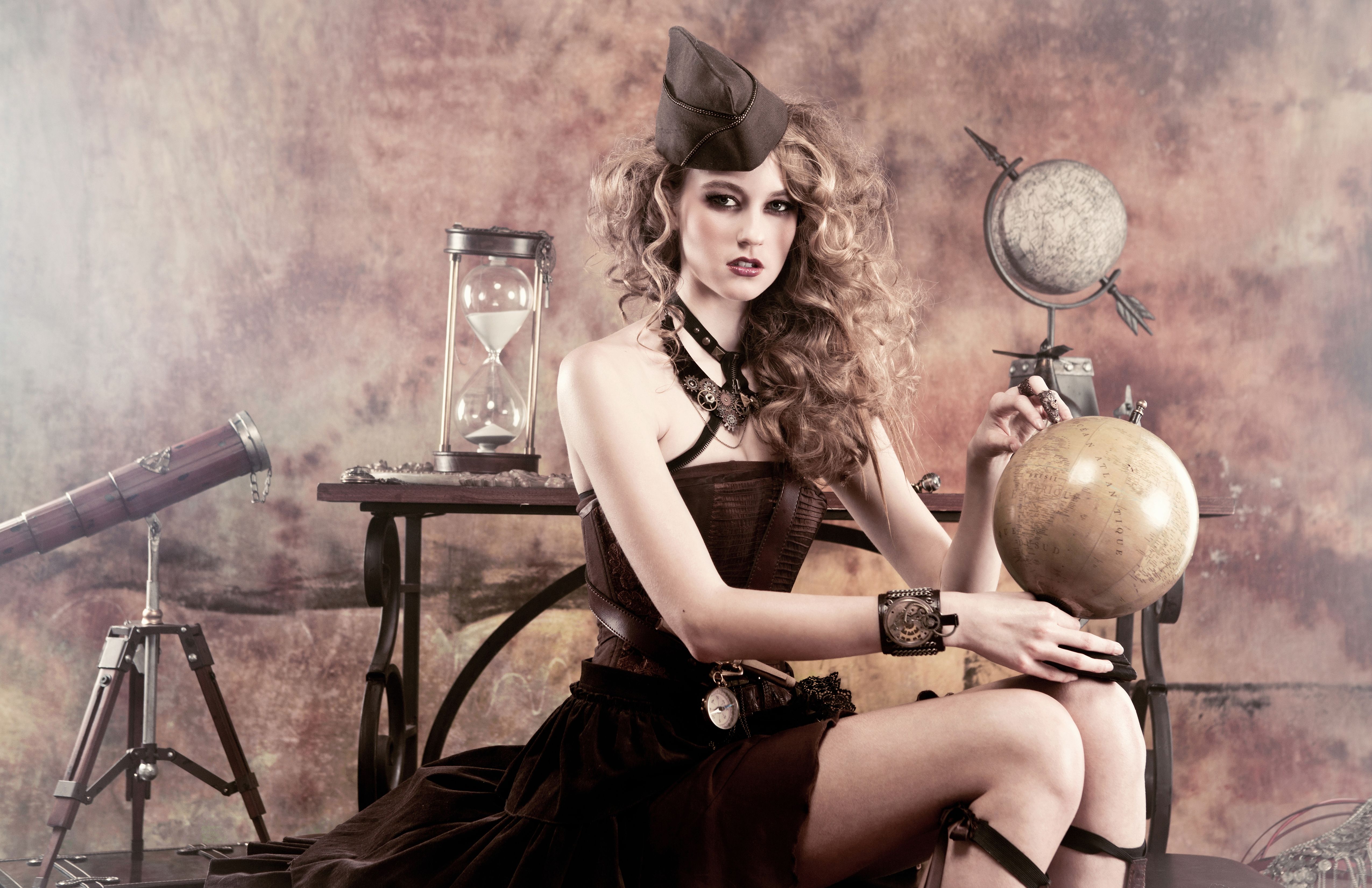 A steampunk woman holding a globe - Steampunk