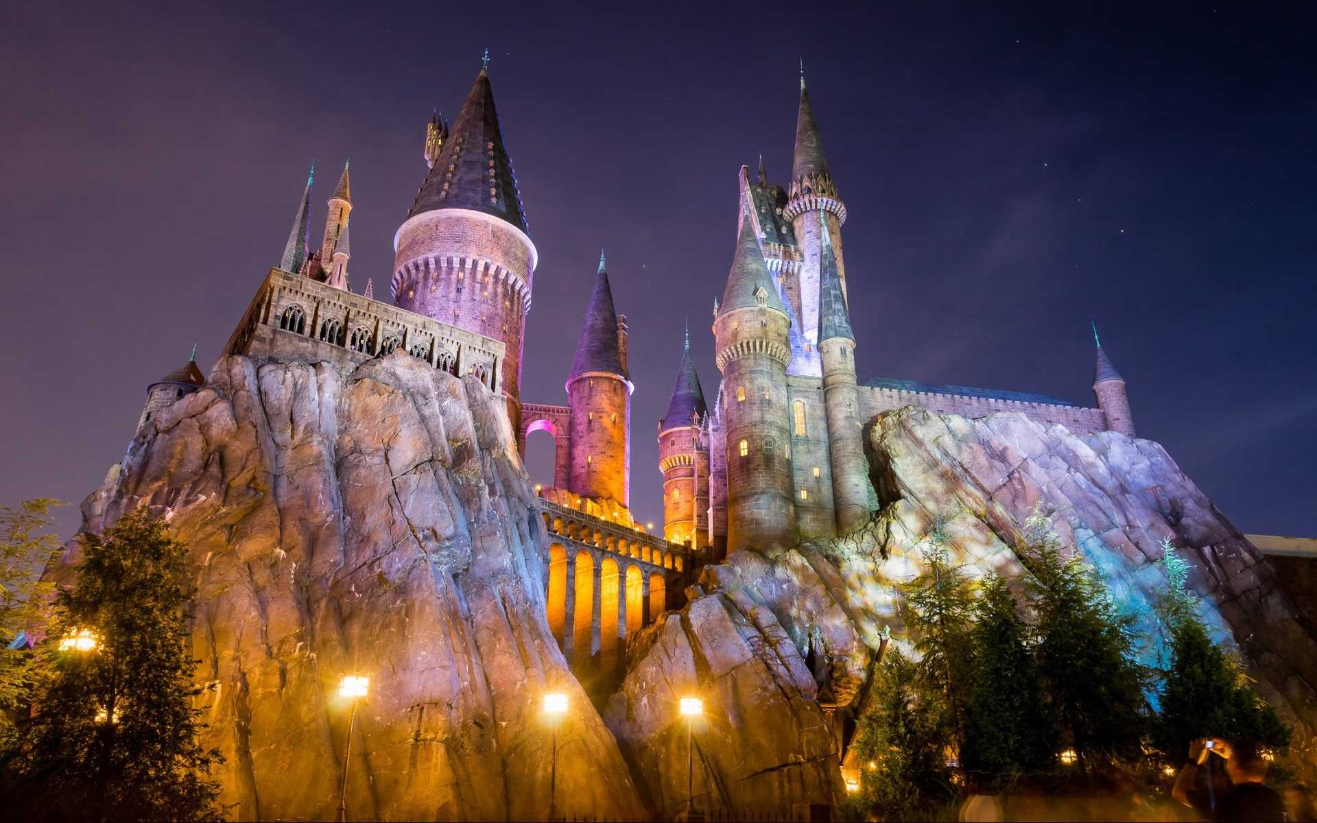 Hogwarts castle at night at Universal Studios Florida, with a starry sky above. - Hogwarts