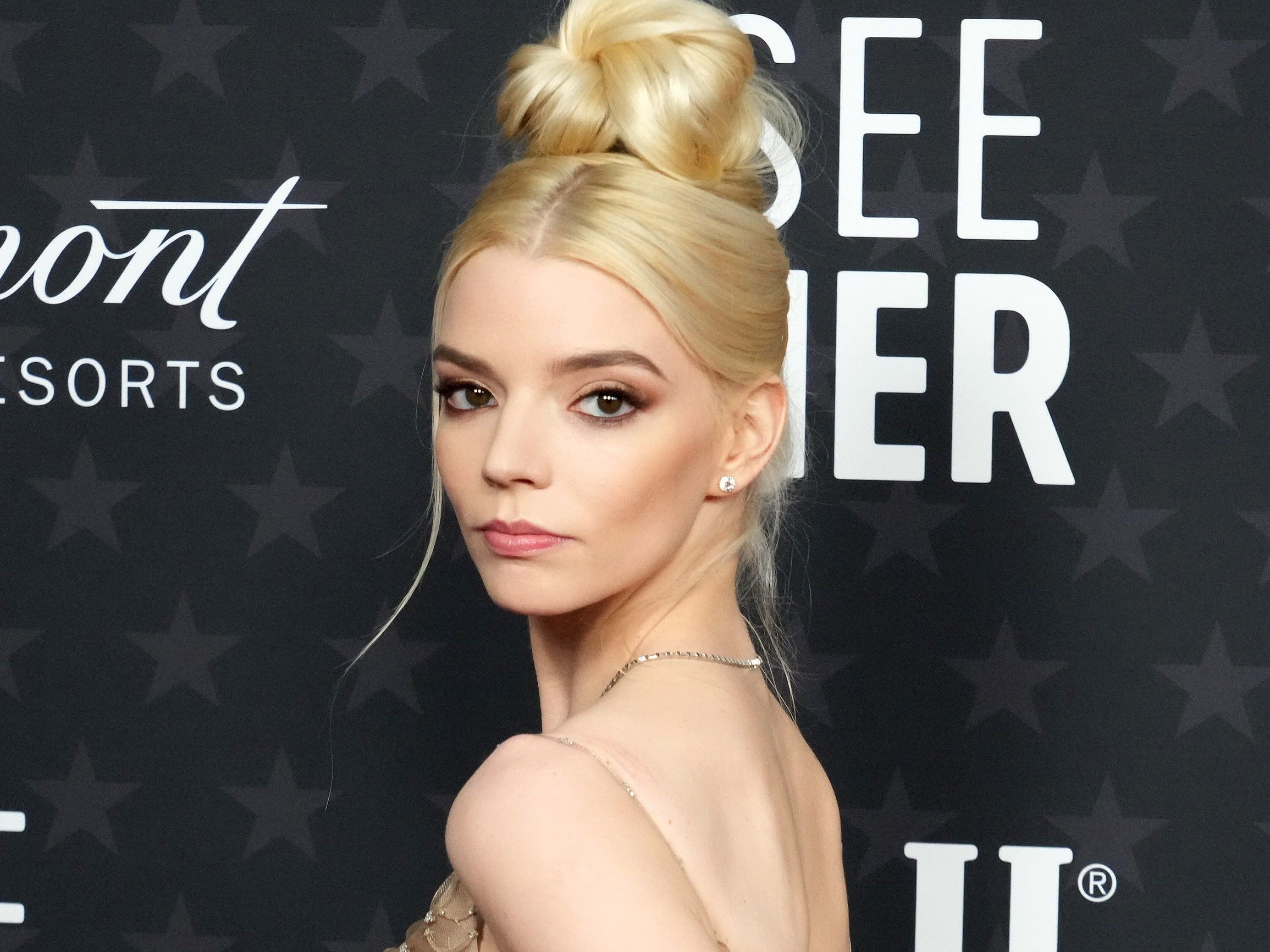 Anya Taylor-Joy at the 2020 SeeHer Award's ceremony in a beige dress with a high bun - Anya Taylor-Joy