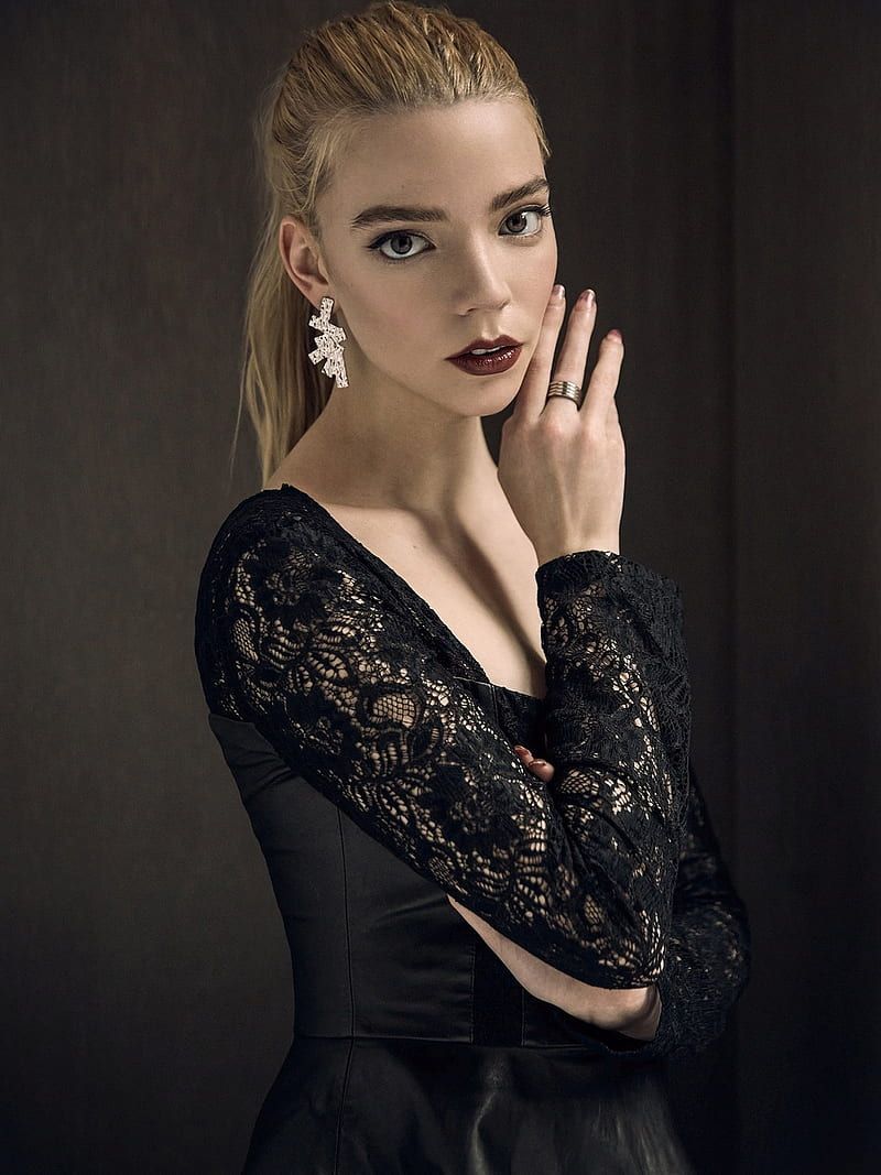 Saoirse Ronan is wearing a black lace top and looking at the camera - Anya Taylor-Joy