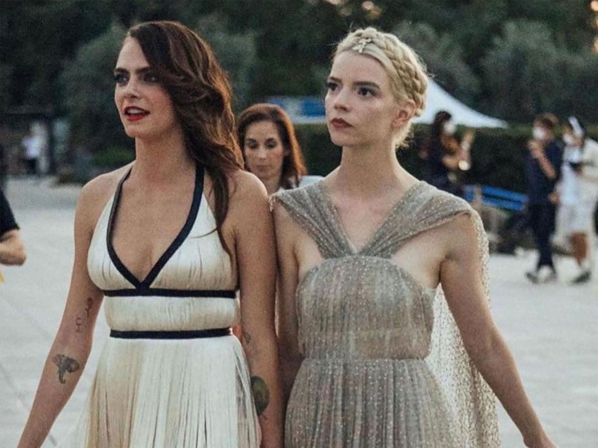 Cara Delevingne and girlfriend Ashley Benson walking arm in arm at a wedding. - Anya Taylor-Joy
