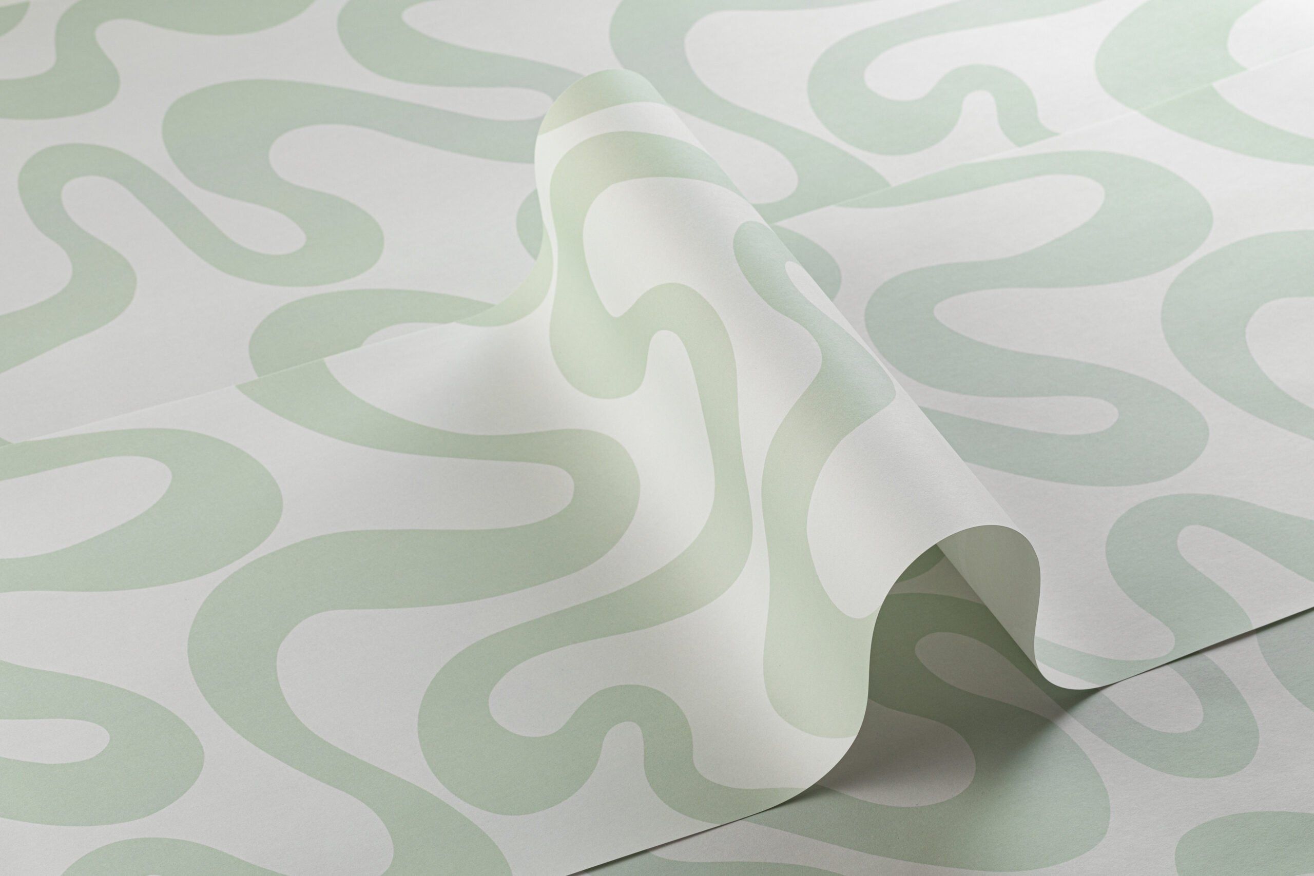 A pale green and white swirled pattern on a sheet of paper - Mint green