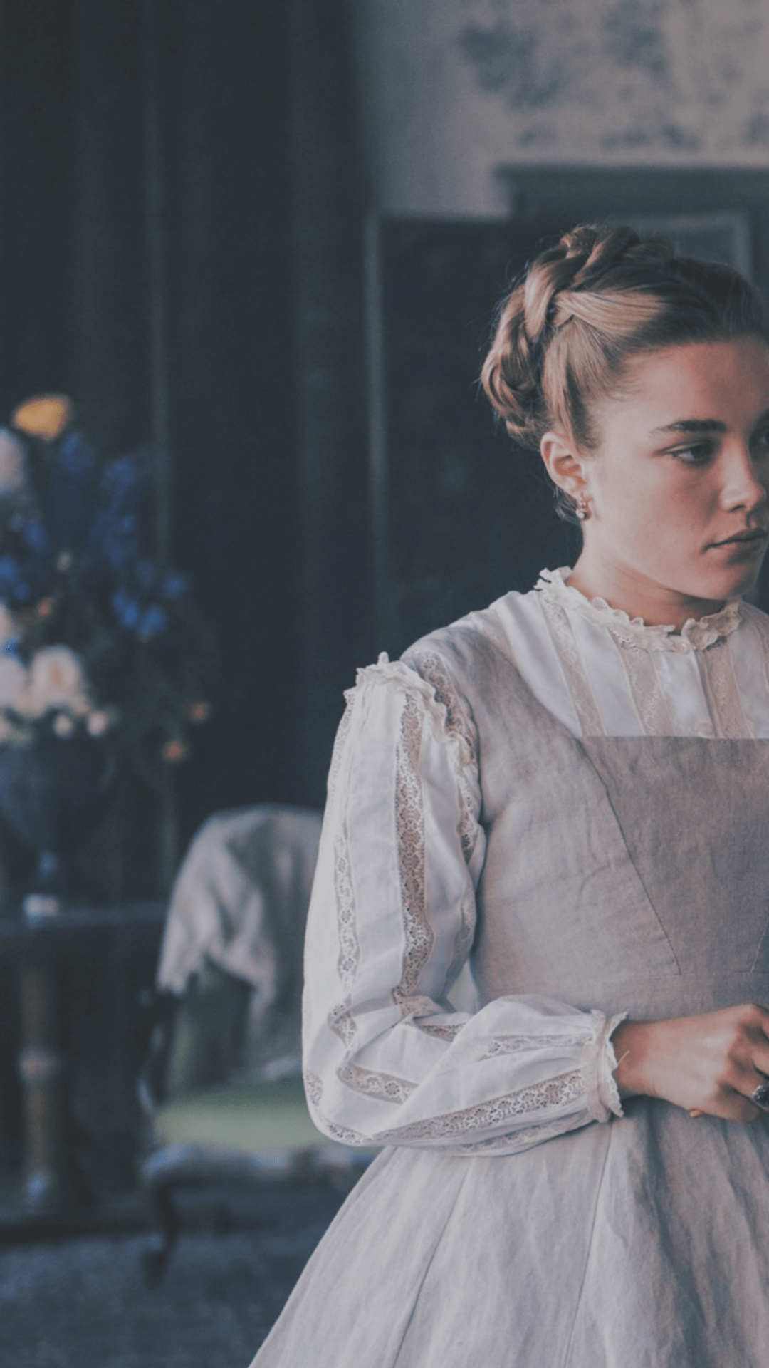 A woman in a white dress holding a book. - Florence Pugh
