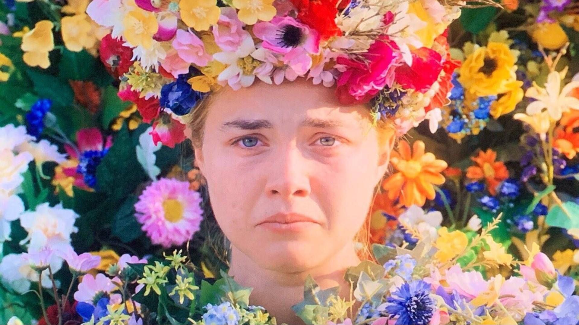 A woman with a flower crown and flowers in her hair - Florence Pugh