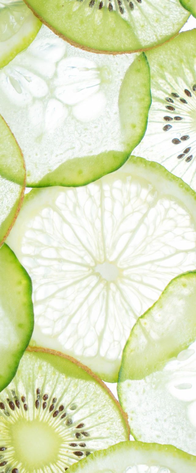 A close up of cucumber, kiwi and lime slices - Kiwi