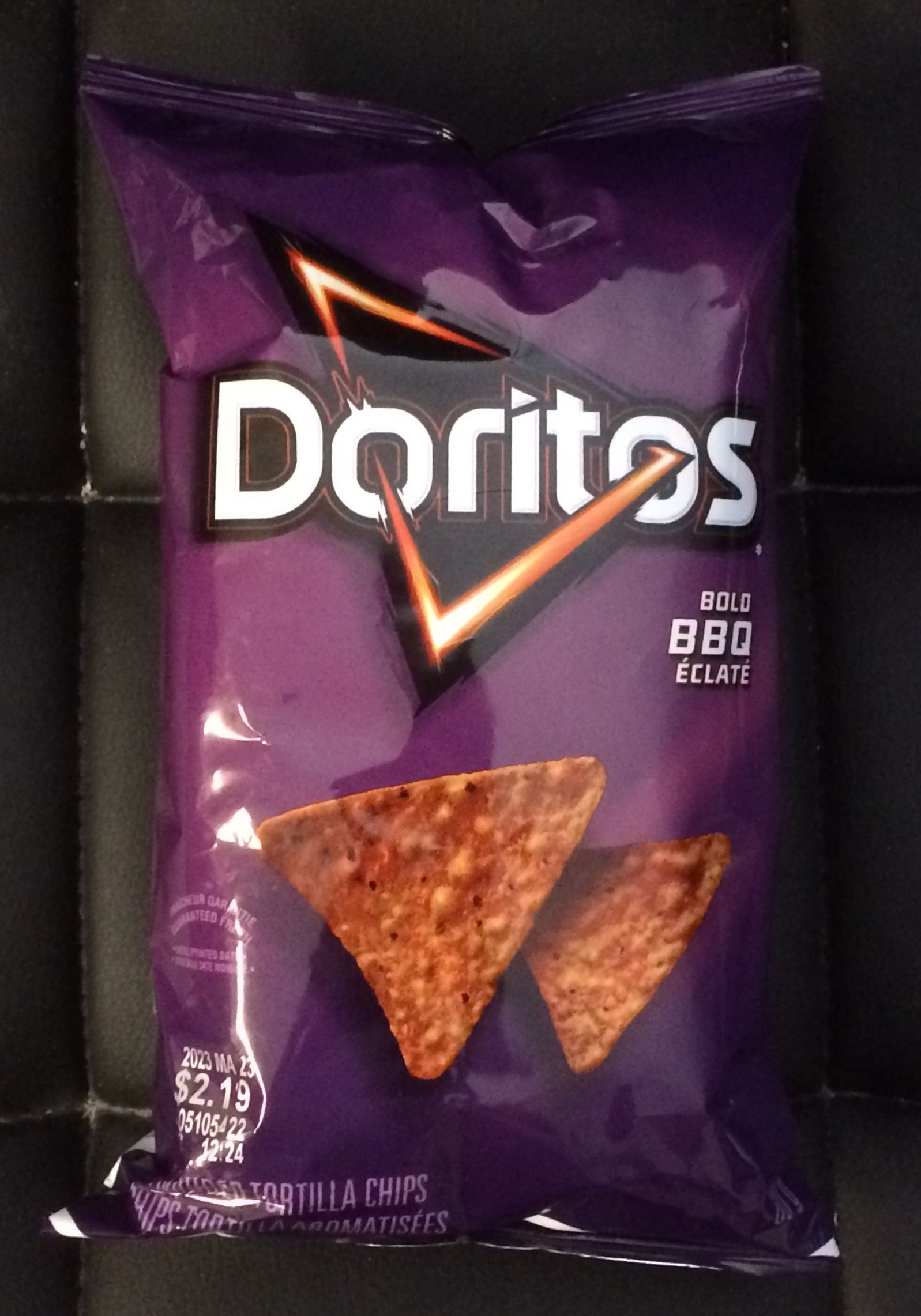 A bag of Doritos BBQ chips on a shelf. - Doritos