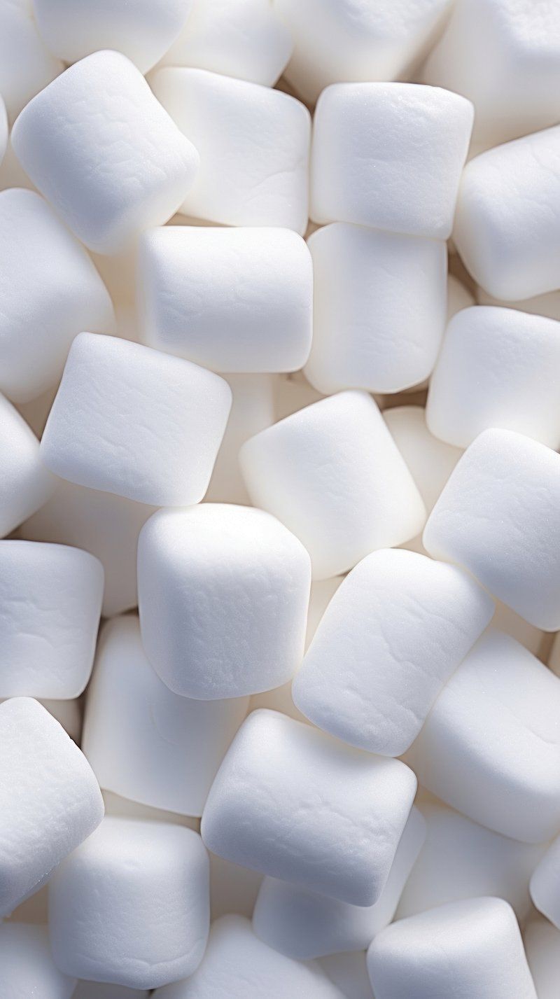 A pile of marshmallows on a white background - Marshmallows