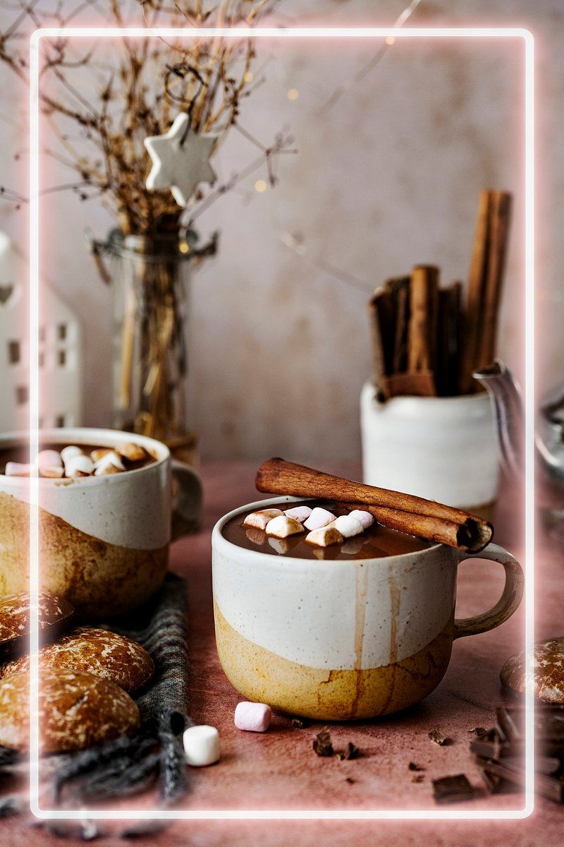 A cup of hot chocolate with marshmallows and cinnamon sticks - Marshmallows