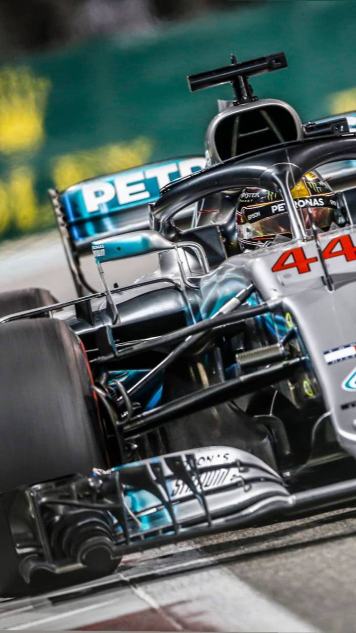 A Mercedes-AMG Petronas F1 car in action on the track - Lewis Hamilton