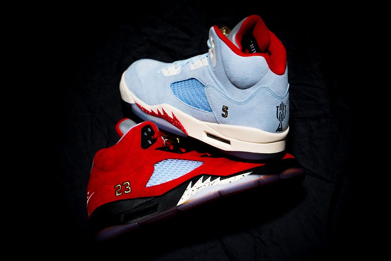 A pair of red and blue sneakers on a black background. - Air Jordan 5
