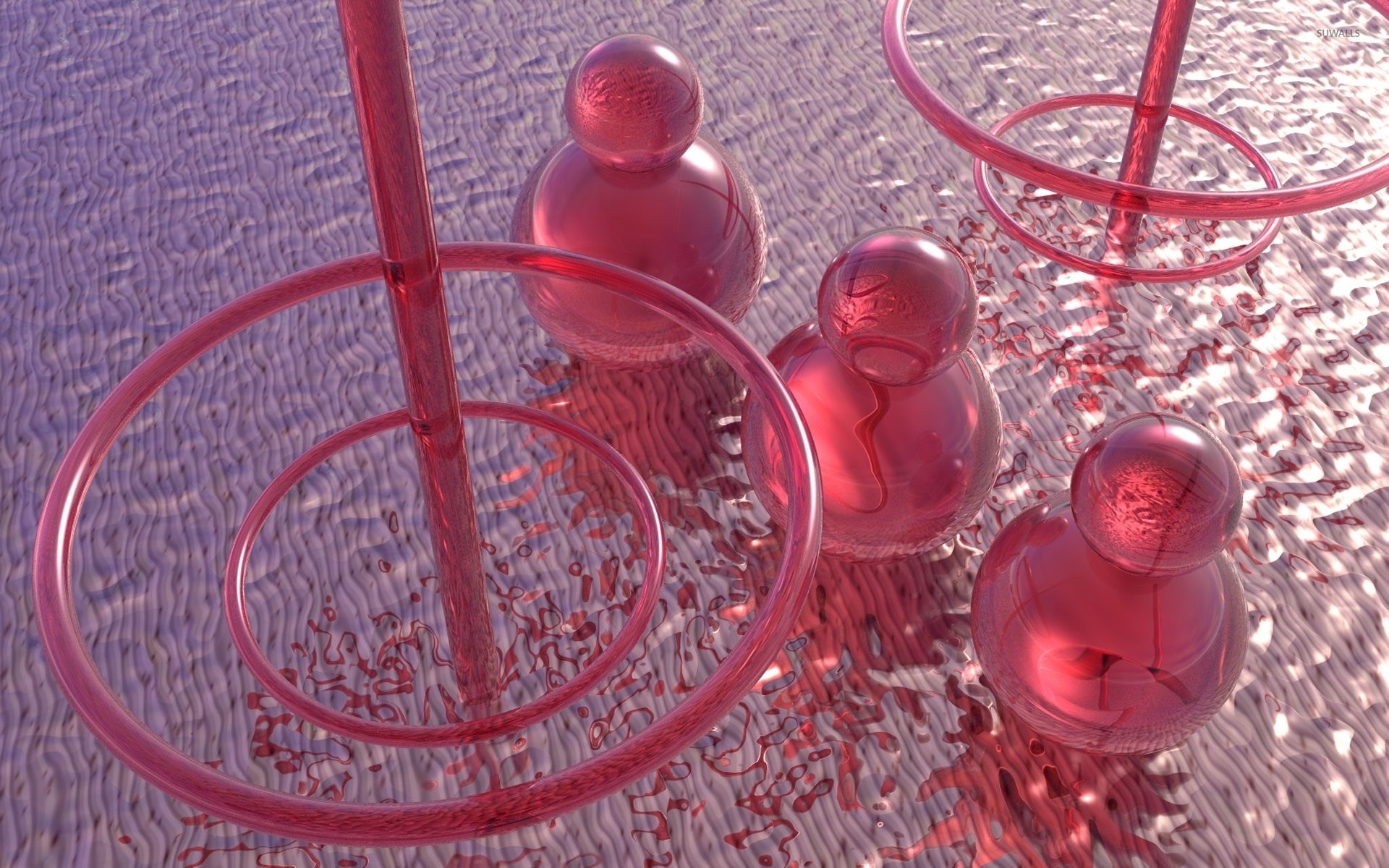 Red glass objects including circles and spheres are scattered on a metallic surface. - Chemistry