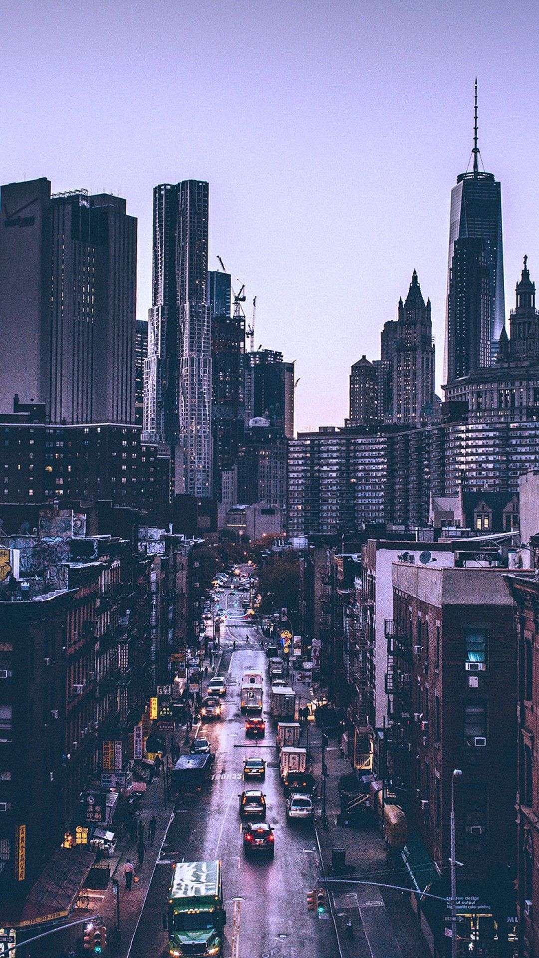 A street in New York City at dusk with tall buildings - City, skyline, cityscape