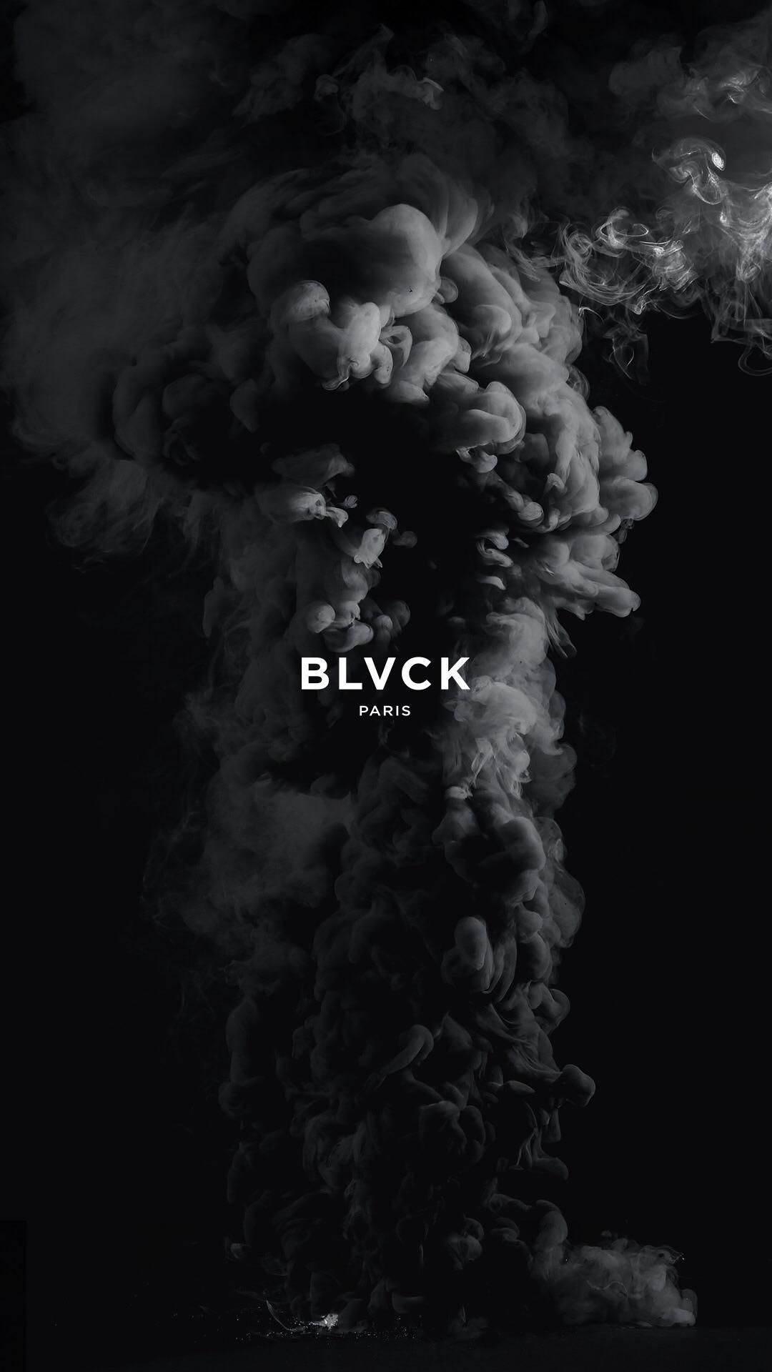 Black wallpaper with smoke and the word 