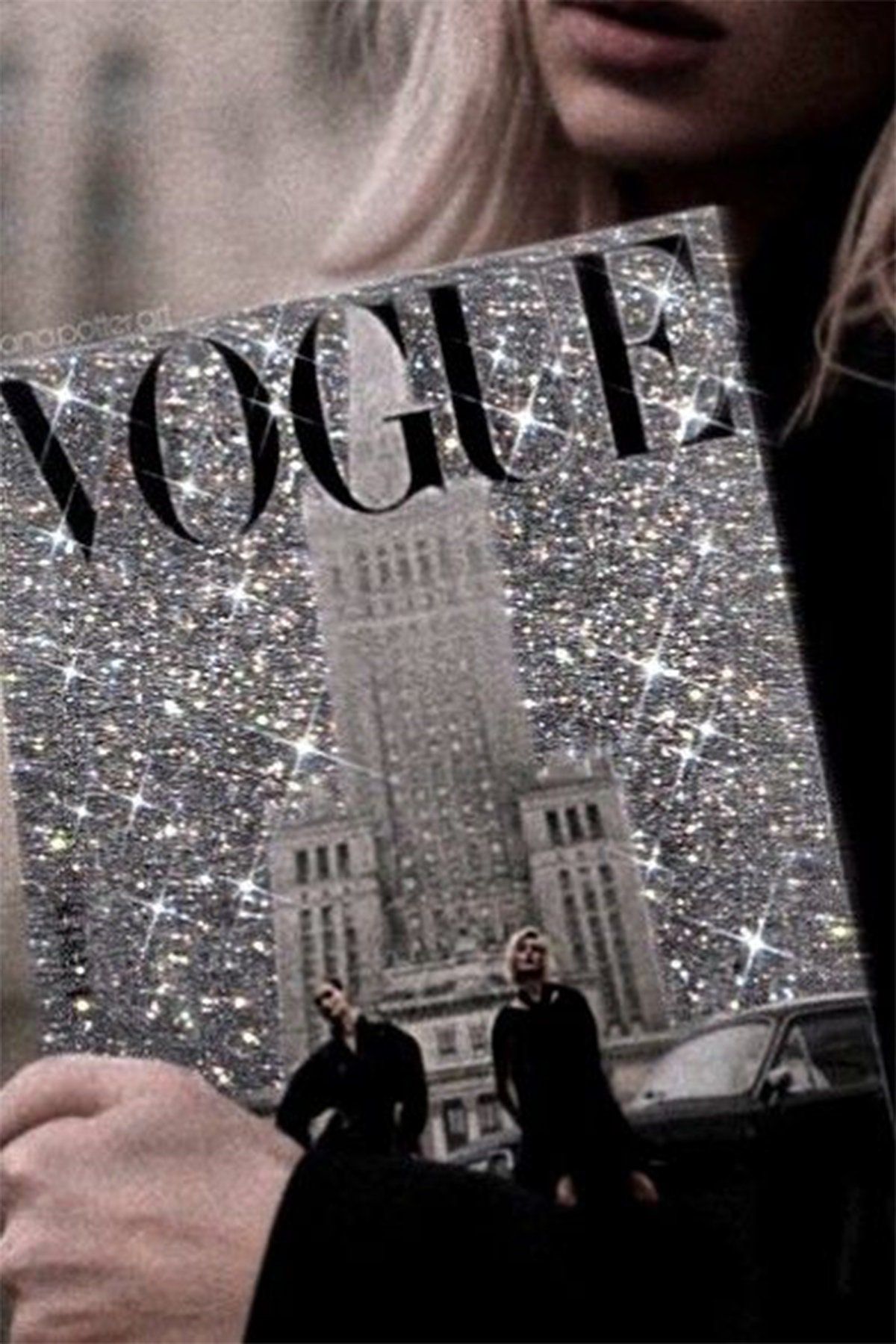 A woman holding a copy of Vogue magazine. - Boujee
