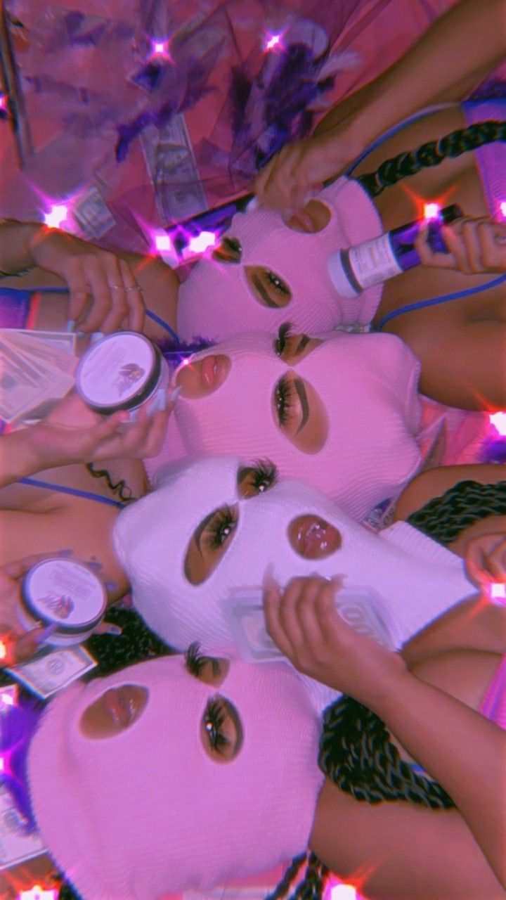 A group of women wearing pink ski masks. - Gangster