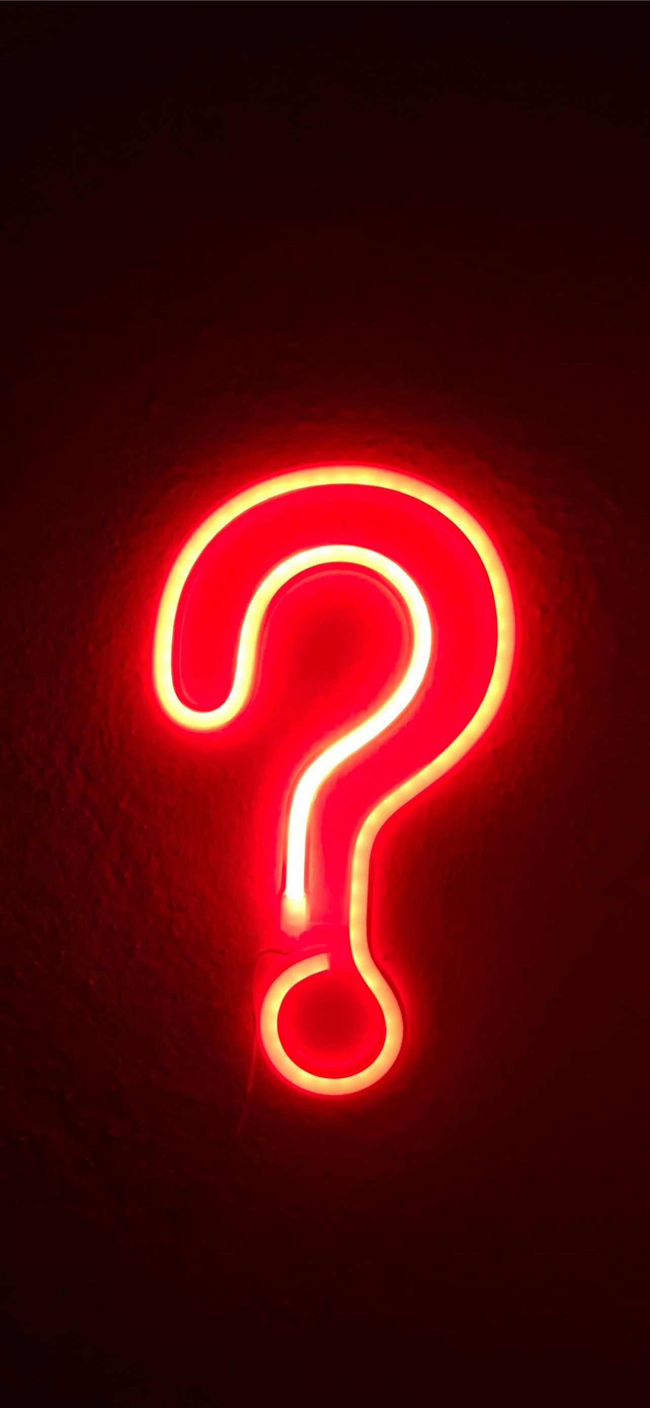 A red neon sign in the shape of a question mark. - Neon orange, iPhone red, light red, neon red