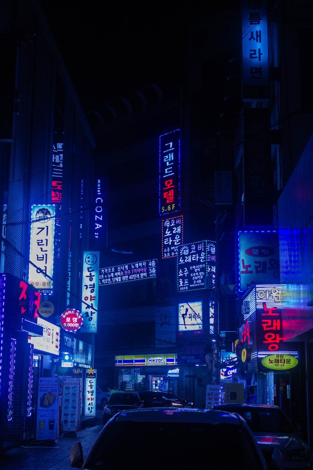 A city street at night with bright blue and purple neon lights - Neon blue, neon, Cyberpunk