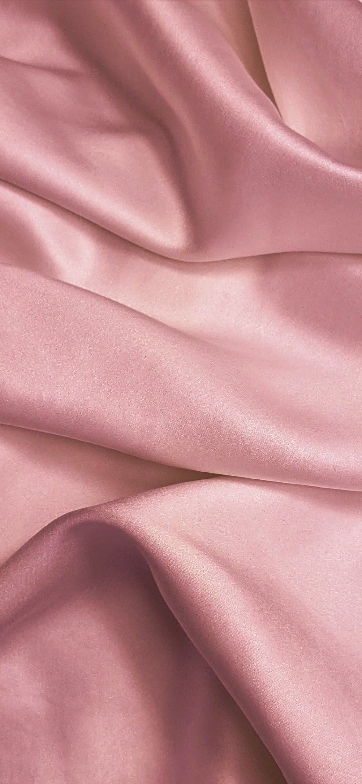 A close up of a pink silk fabric - Soft pink, silk