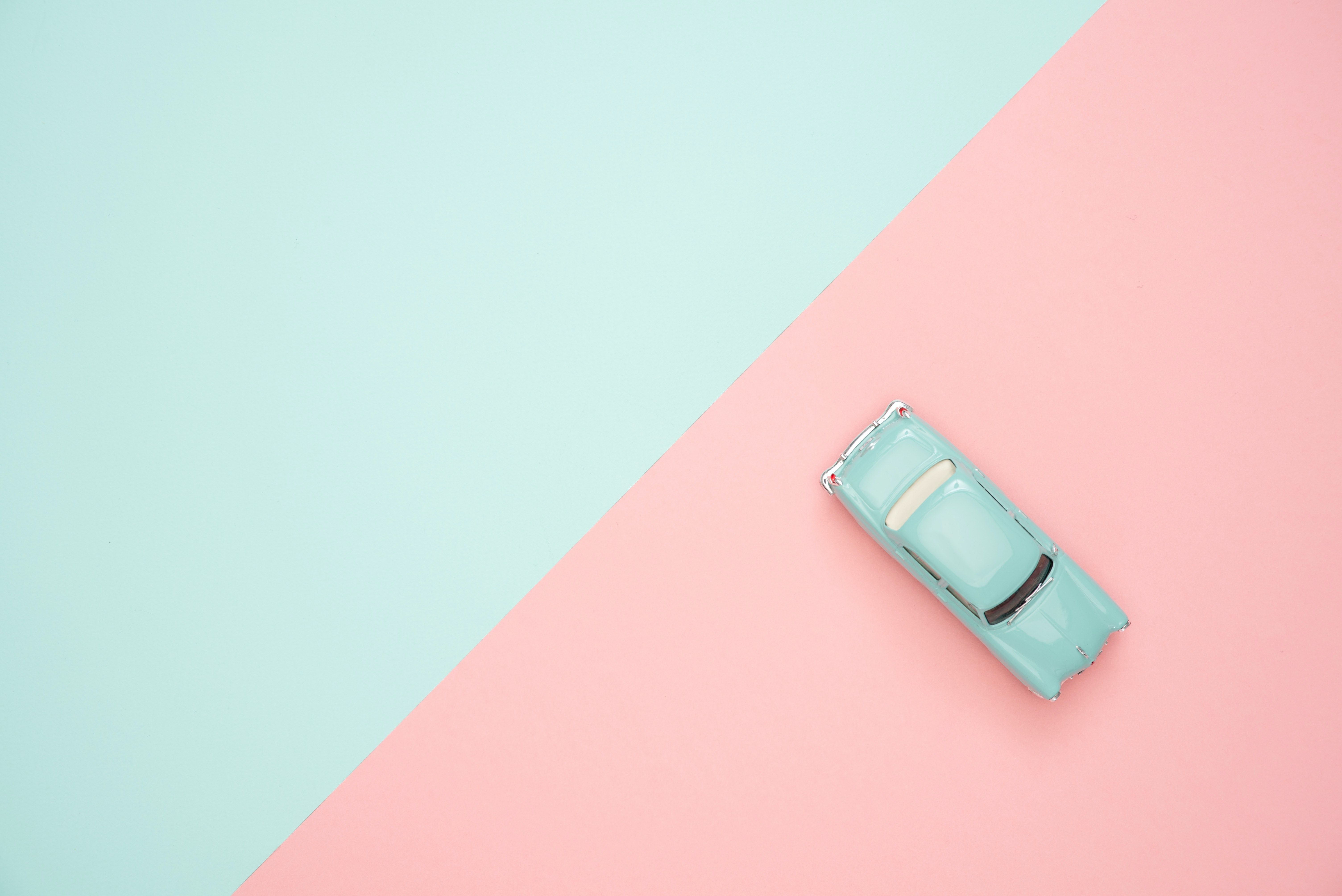 A car is parked on top of two different colored backgrounds - Pastel minimalist