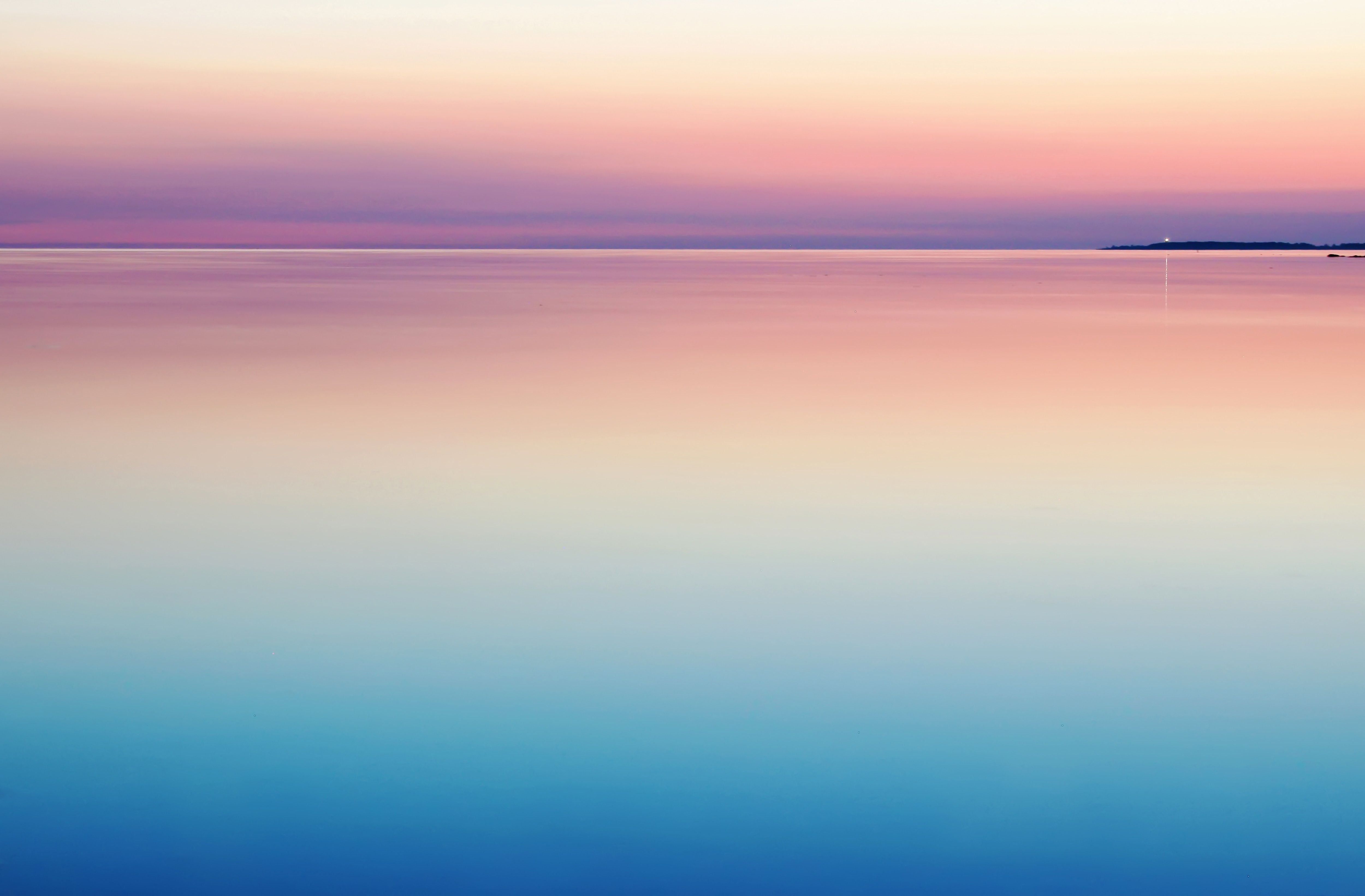 A sunset over the ocean with an island in it - Calming, pastel minimalist, peace