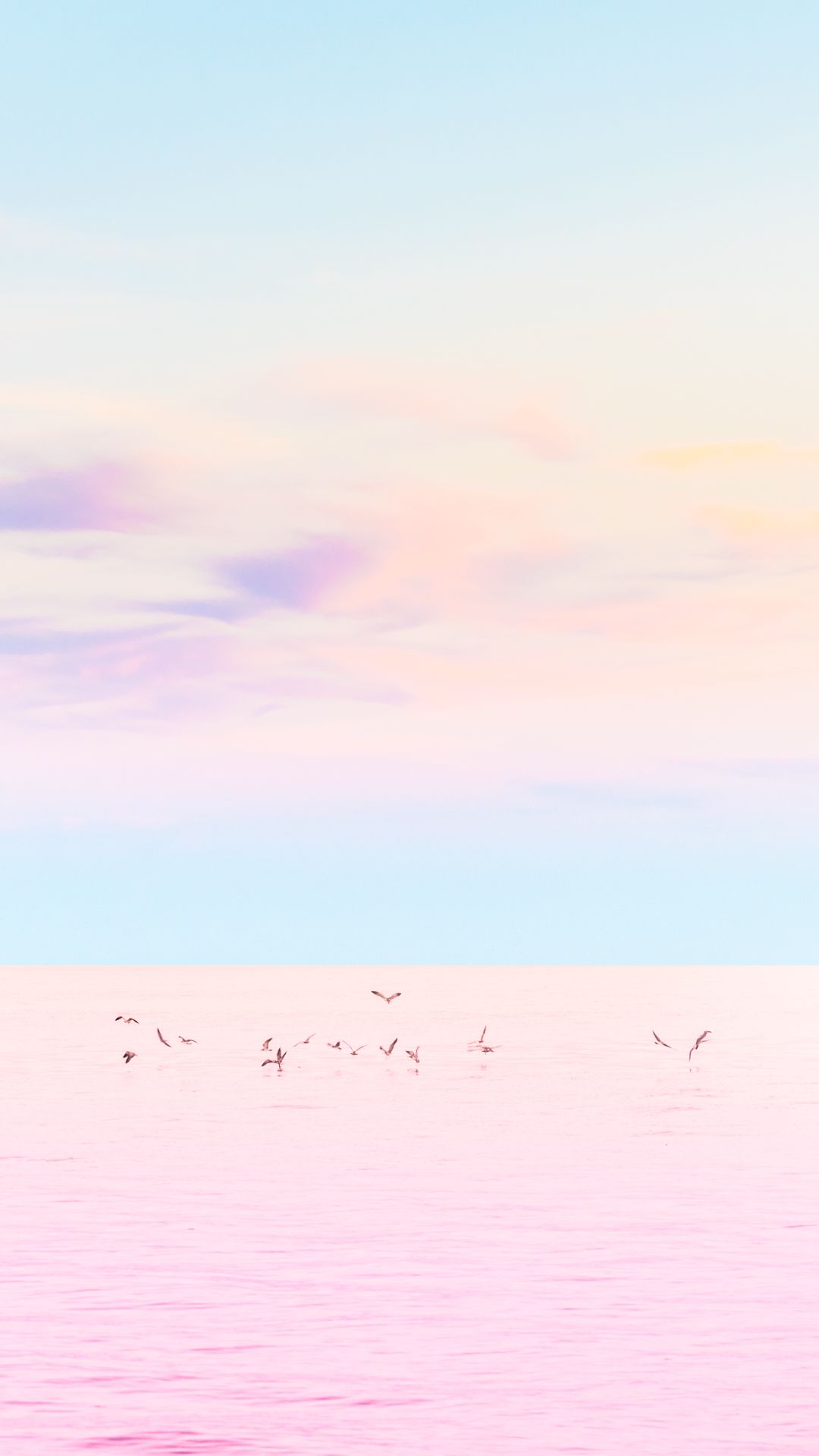 A flock of birds flying over a pink lake - Pastel minimalist