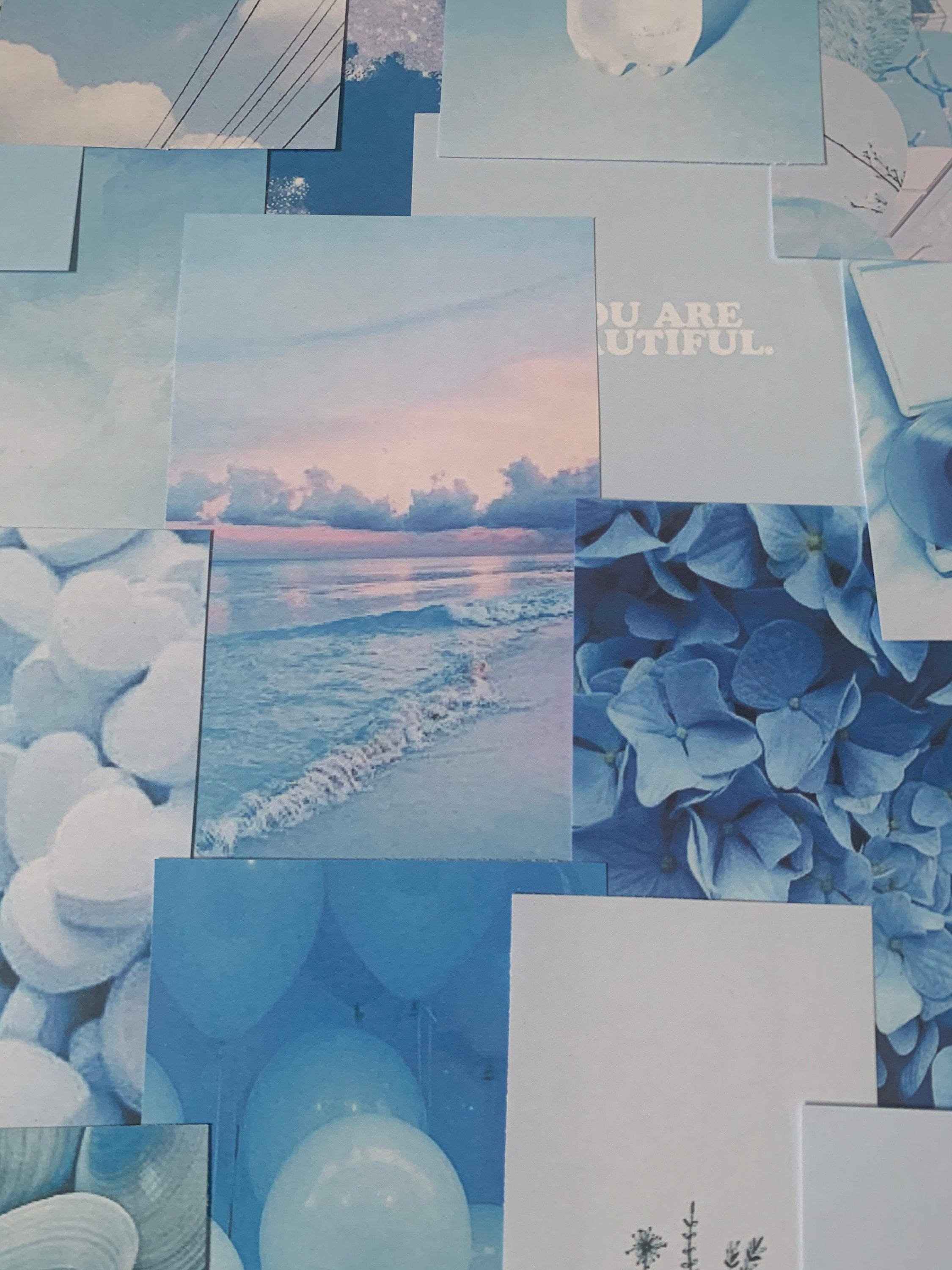 A bunch of pictures on the floor - Light blue, pastel blue