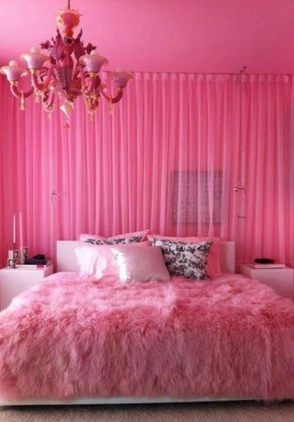 A pink bedroom with chandelier and curtains - Hot pink