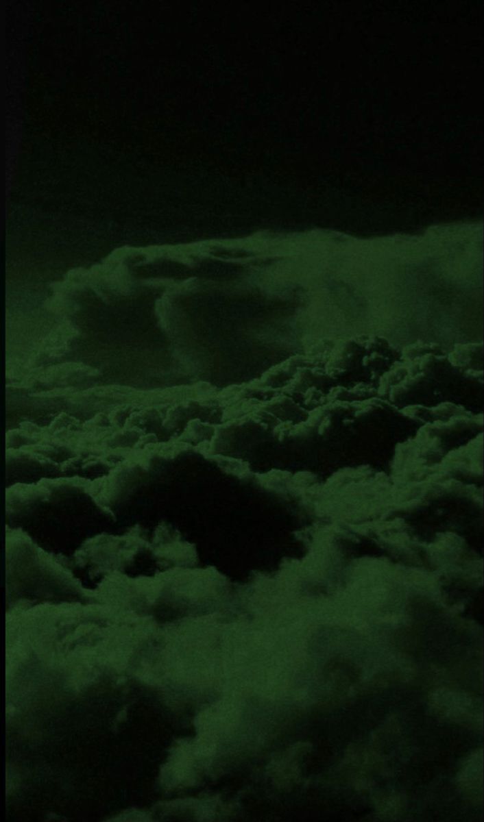 A green sky with clouds in it - Dark green