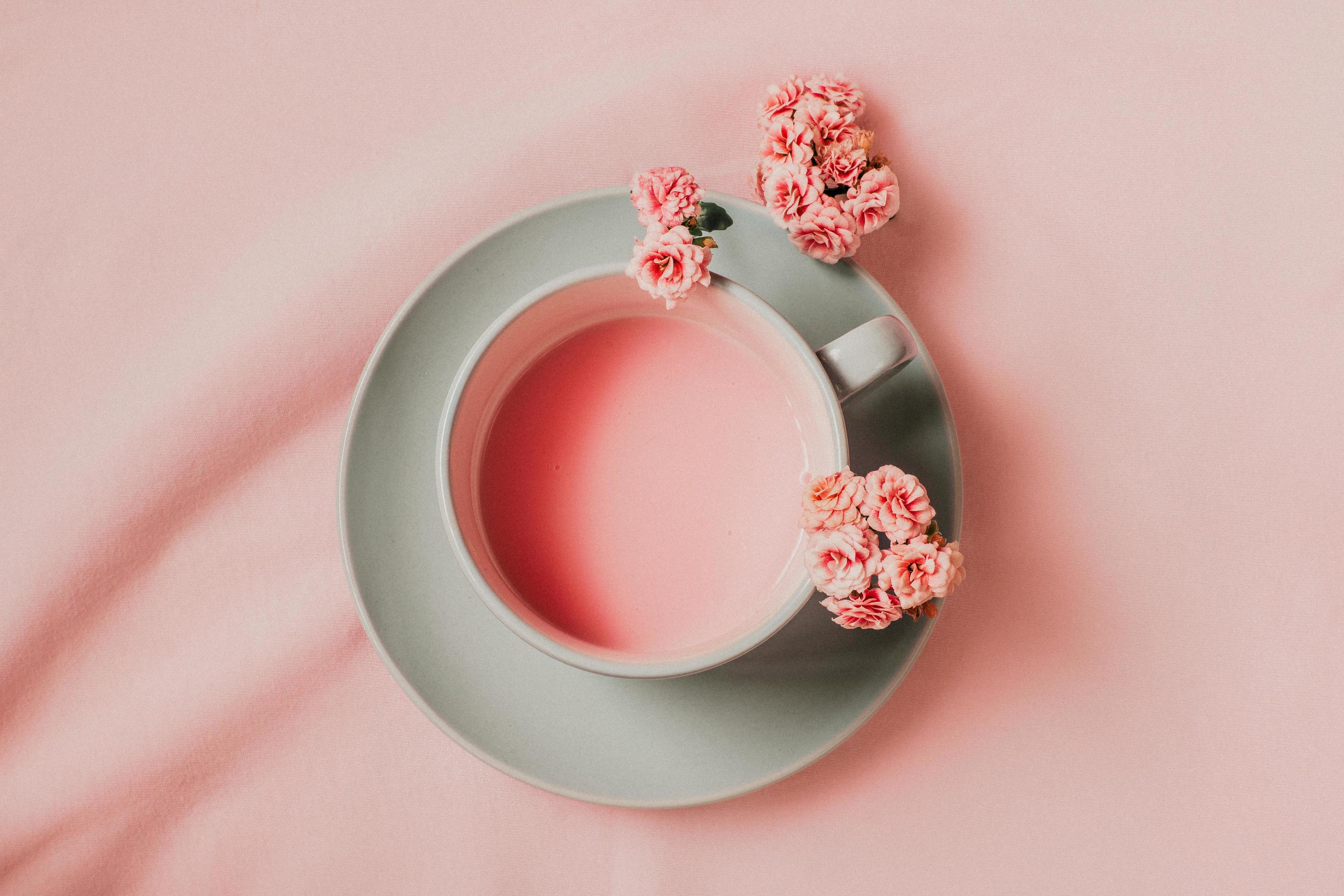 Flat lay pink drink on pink background