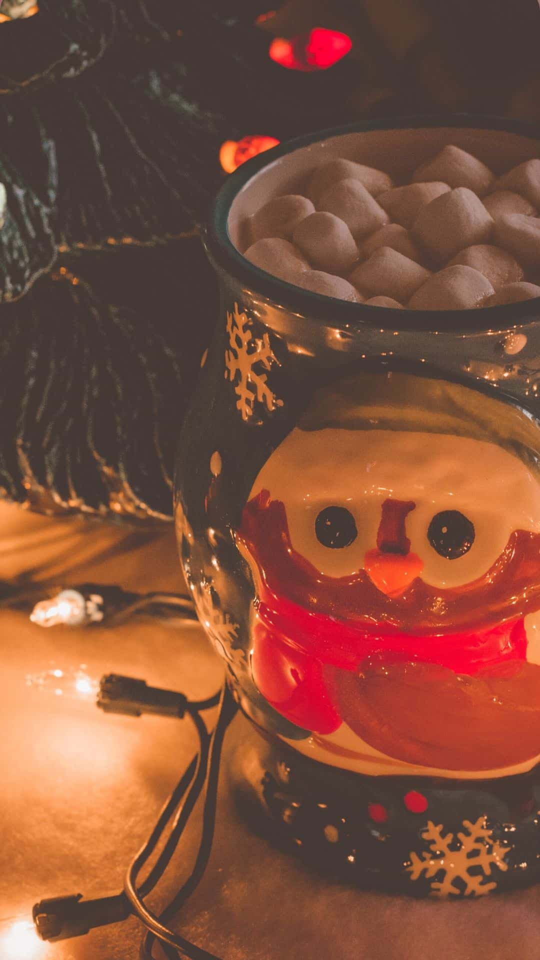 A cup of hot chocolate with marshmallows in it - Christmas iPhone