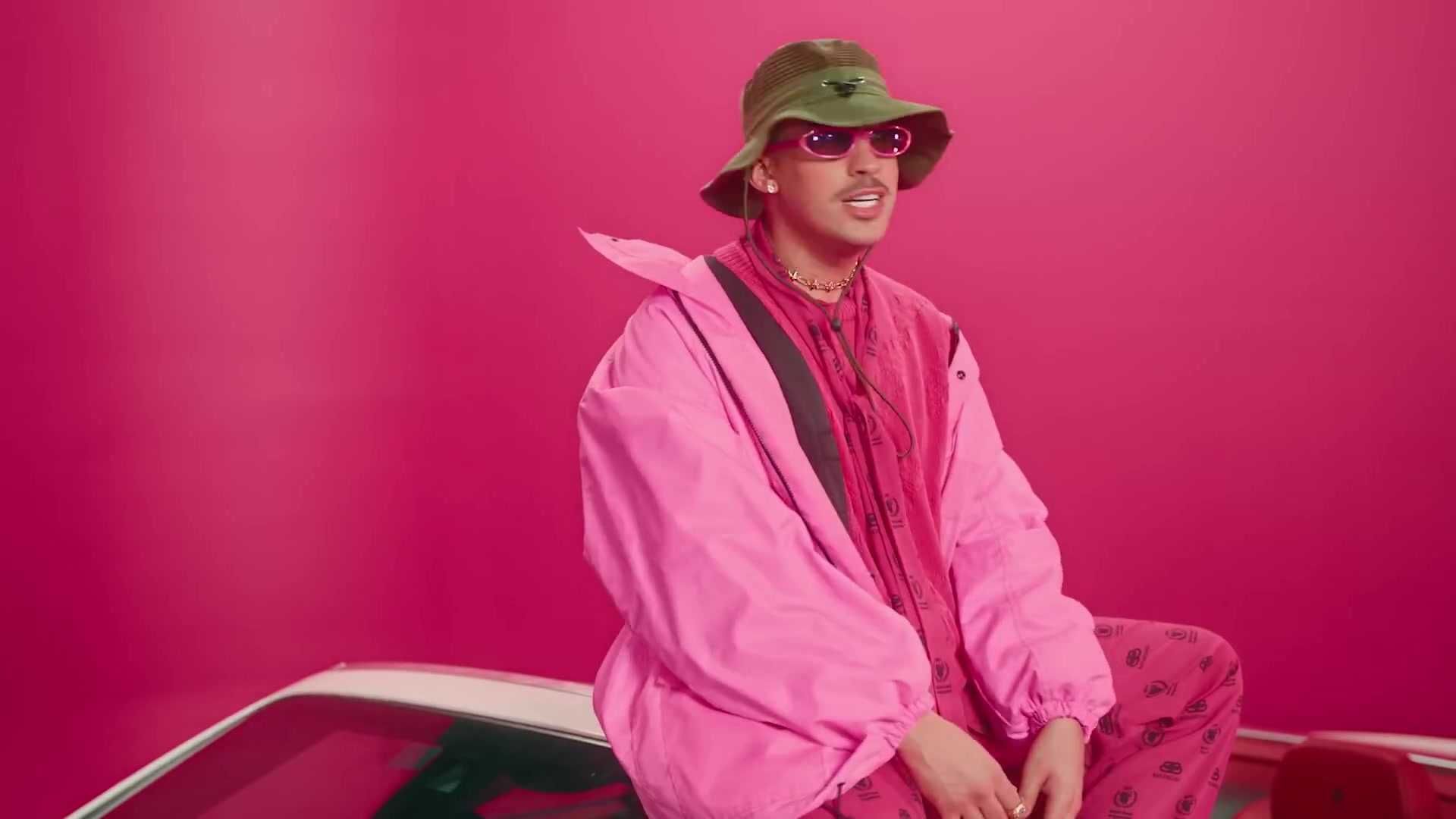 Bad Bunny wearing a pink jacket and hat - Bad Bunny