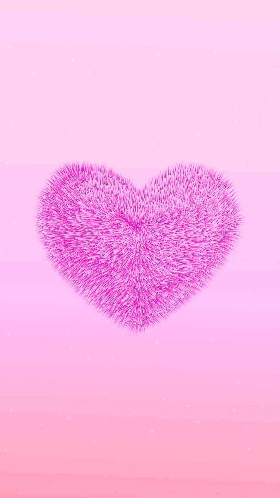 A pink heart shaped object on top of an orange background - Heart, pink phone