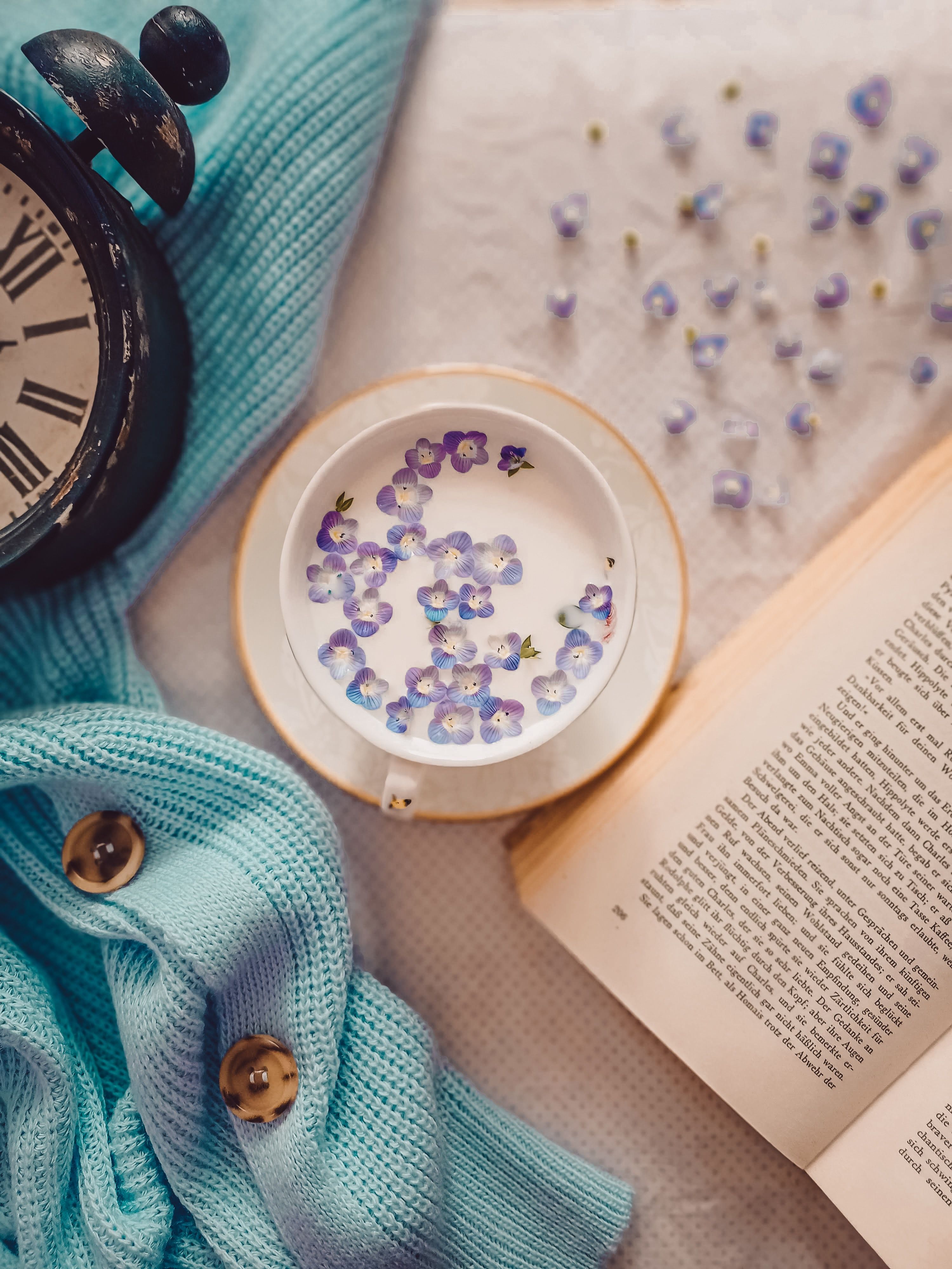 A clock, book and cup of tea on the table - Books, vintage fall, milk