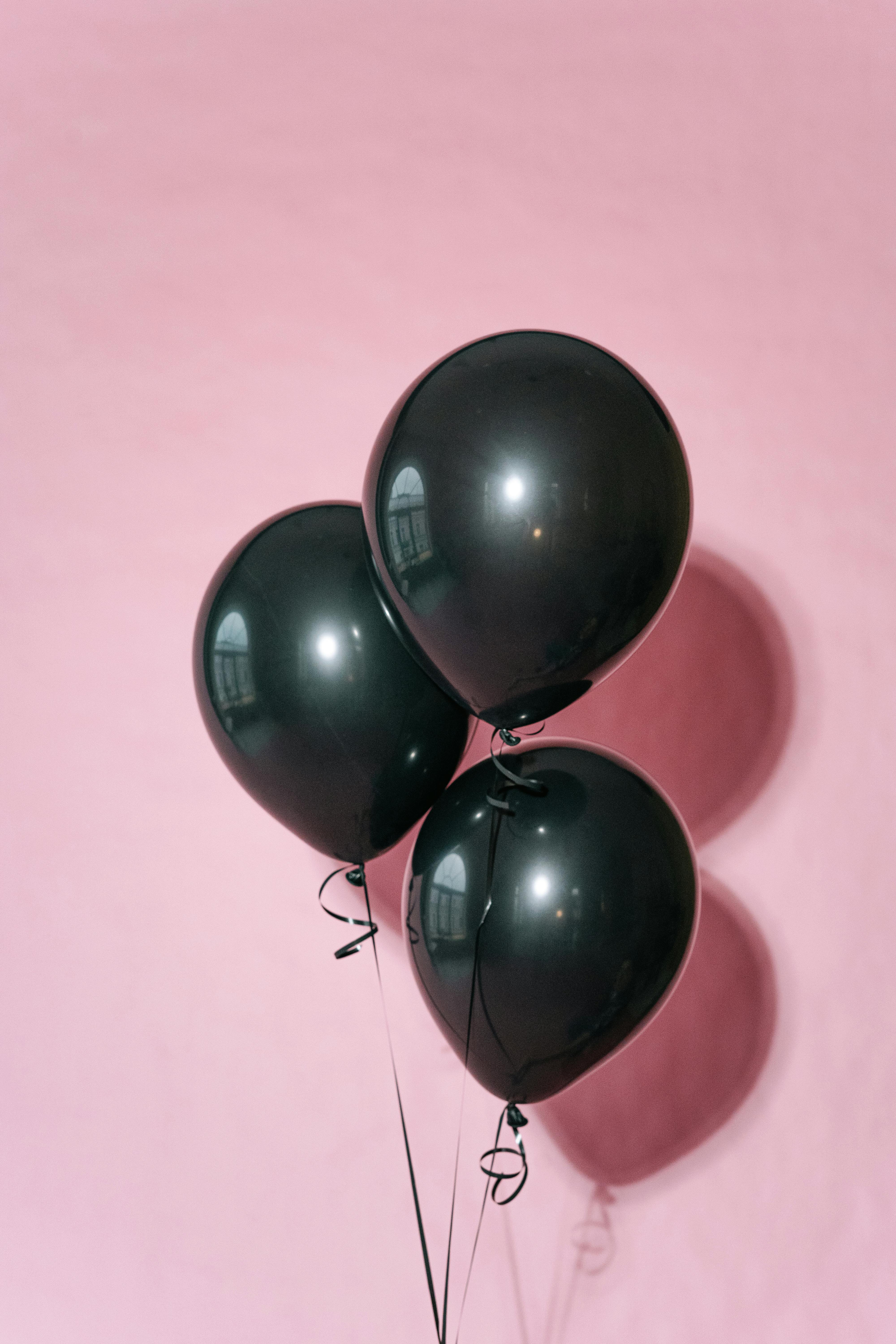 Black Balloons on Pink Background