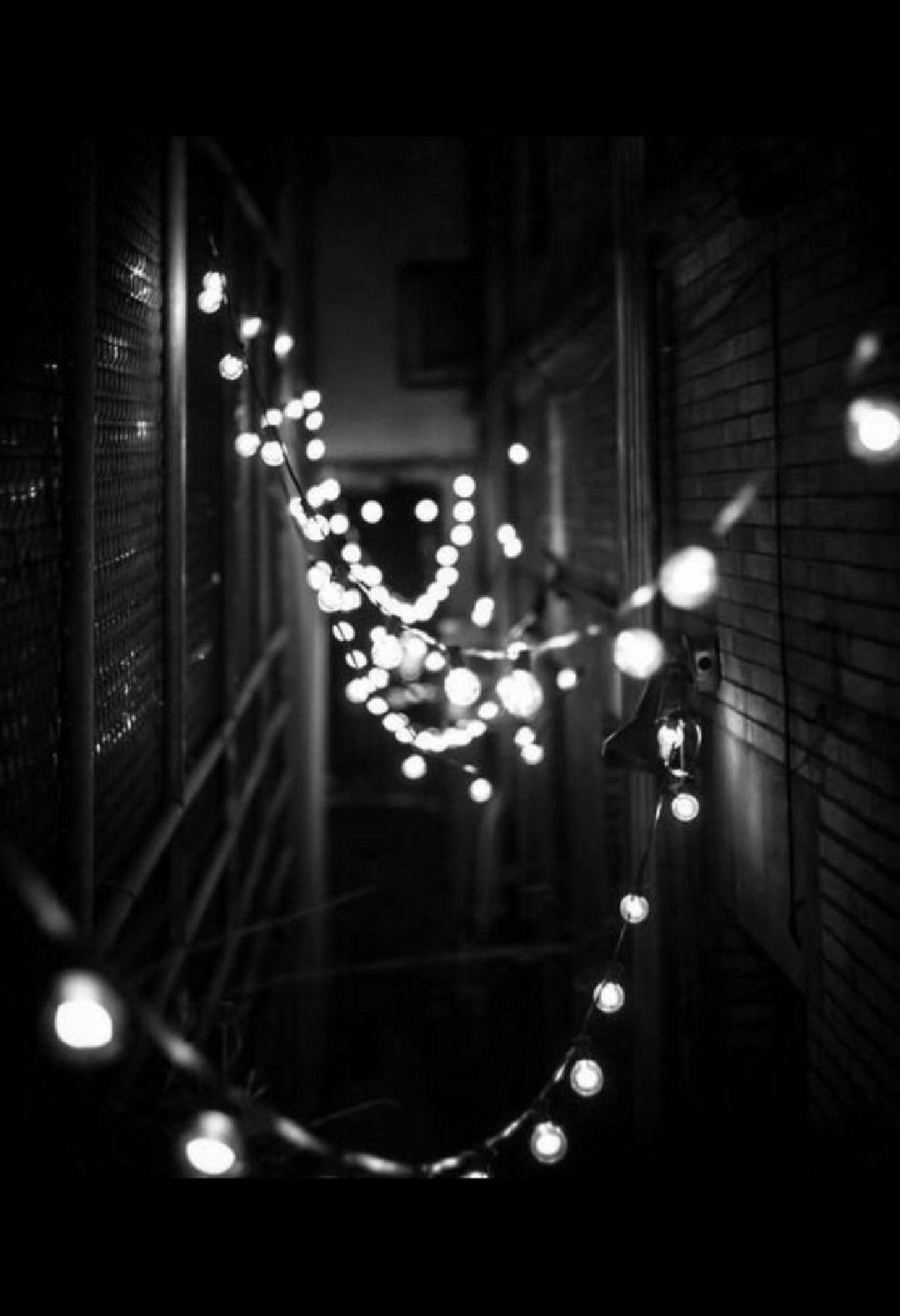 String lights in a dark alley - Black, fairy lights, Christmas lights