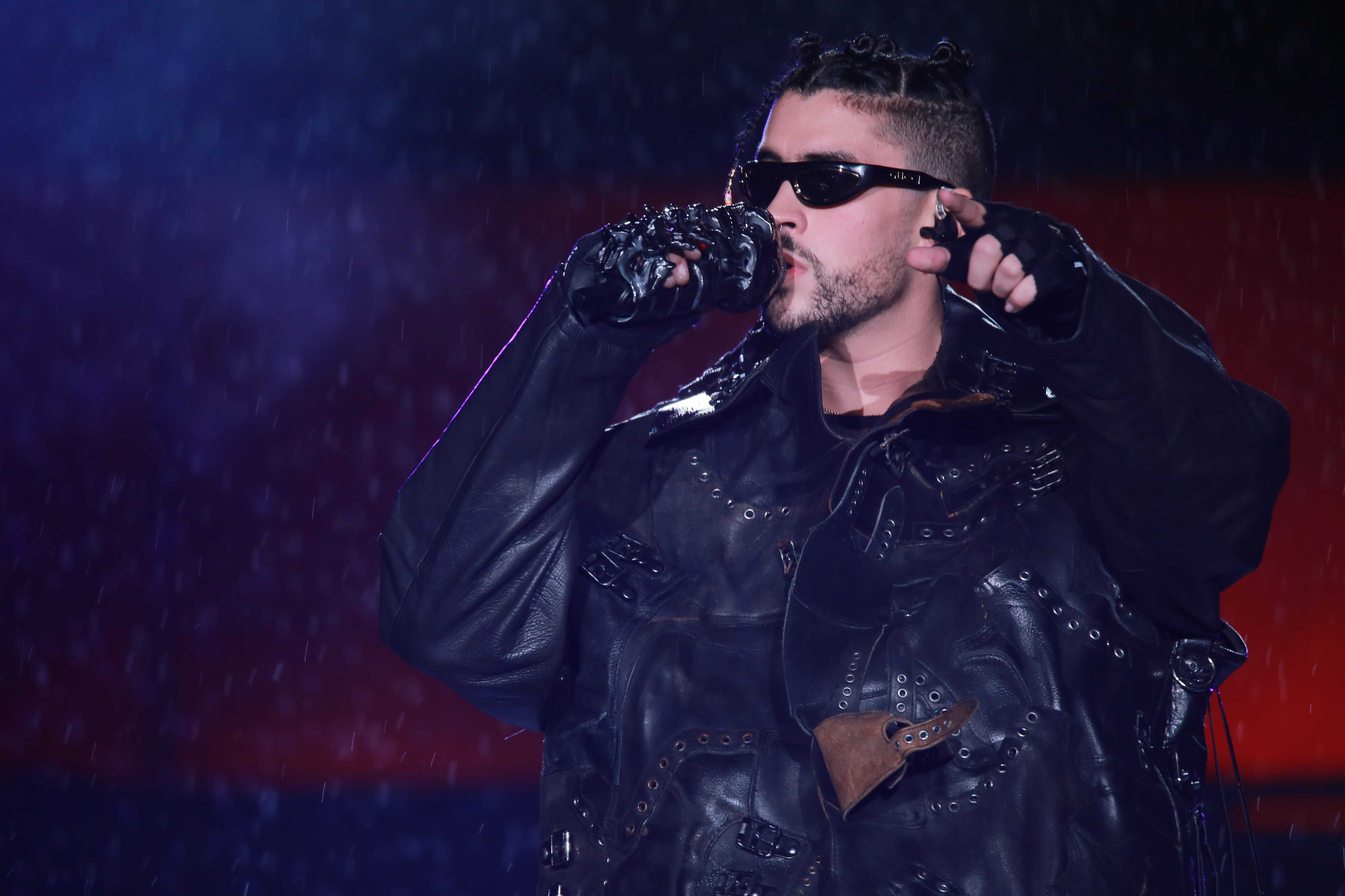 A man in black leather jacket and sunglasses - Bad Bunny