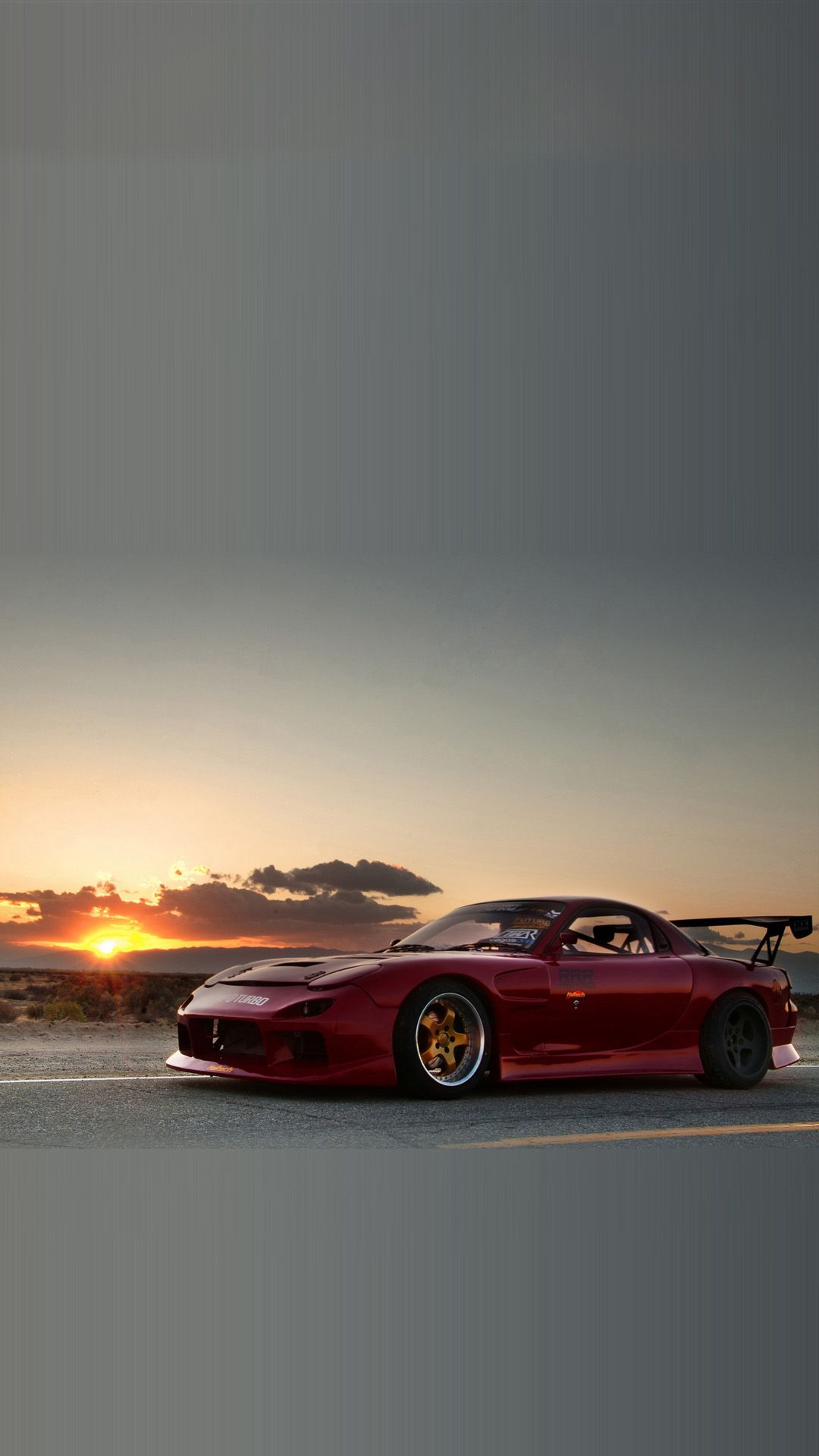 A red sports car on the road during sunset - JDM
