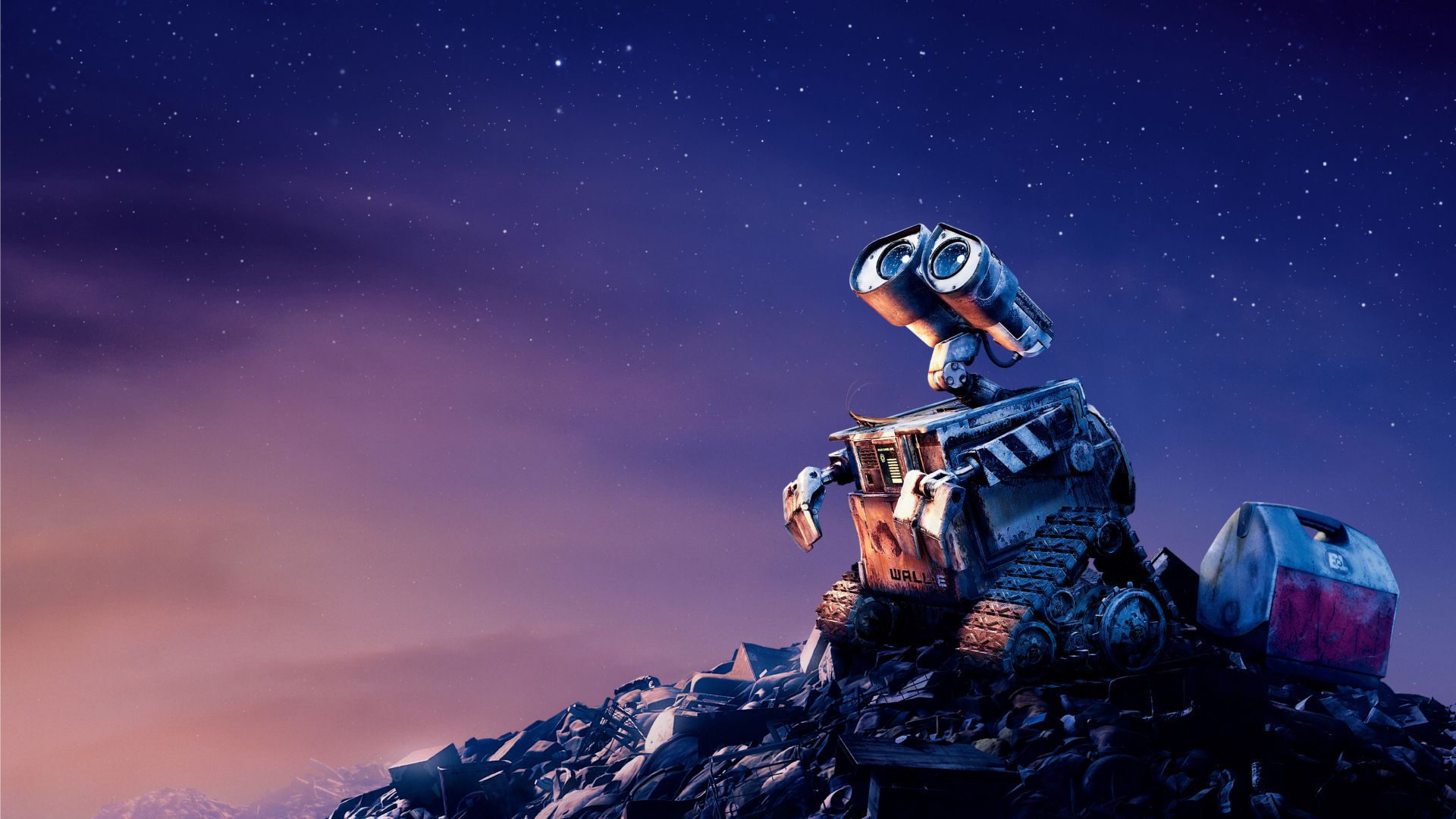 A robot is sitting on top of some rocks - Disney